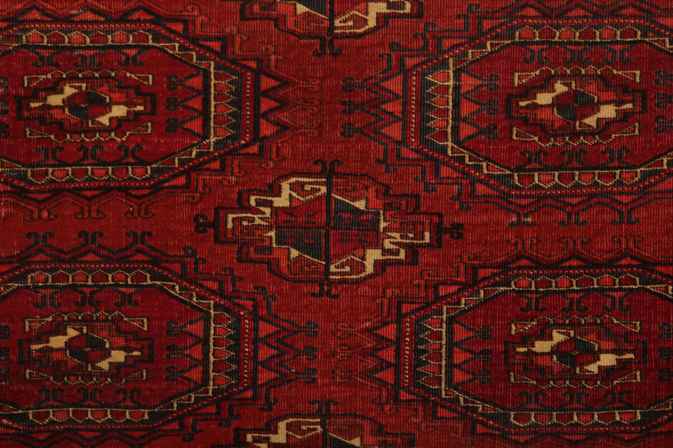 This handmade carpet oriental rug is antique Turkmen hand-woven wool rug was made using traditional vegetable dyes and handmade by the Turkmen tribespeople. This Rug is predominantly red in colour and has a repeated motif pattern covering the rug.
