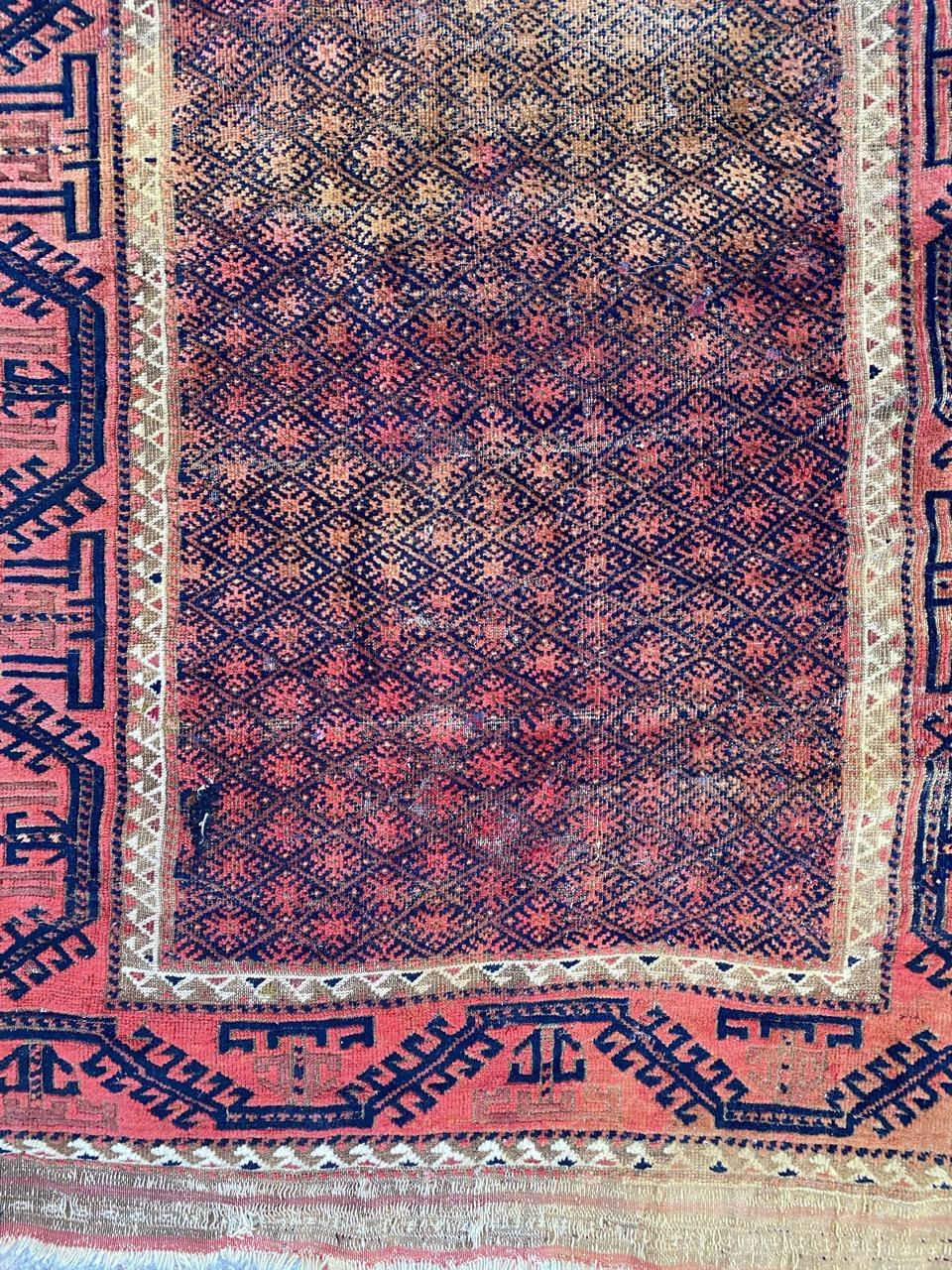 Beautiful late 19th century Baluch rug with a tribal and geometrical design and nice natural colors, entirely hand knotted with wool velvet on wool foundation.
