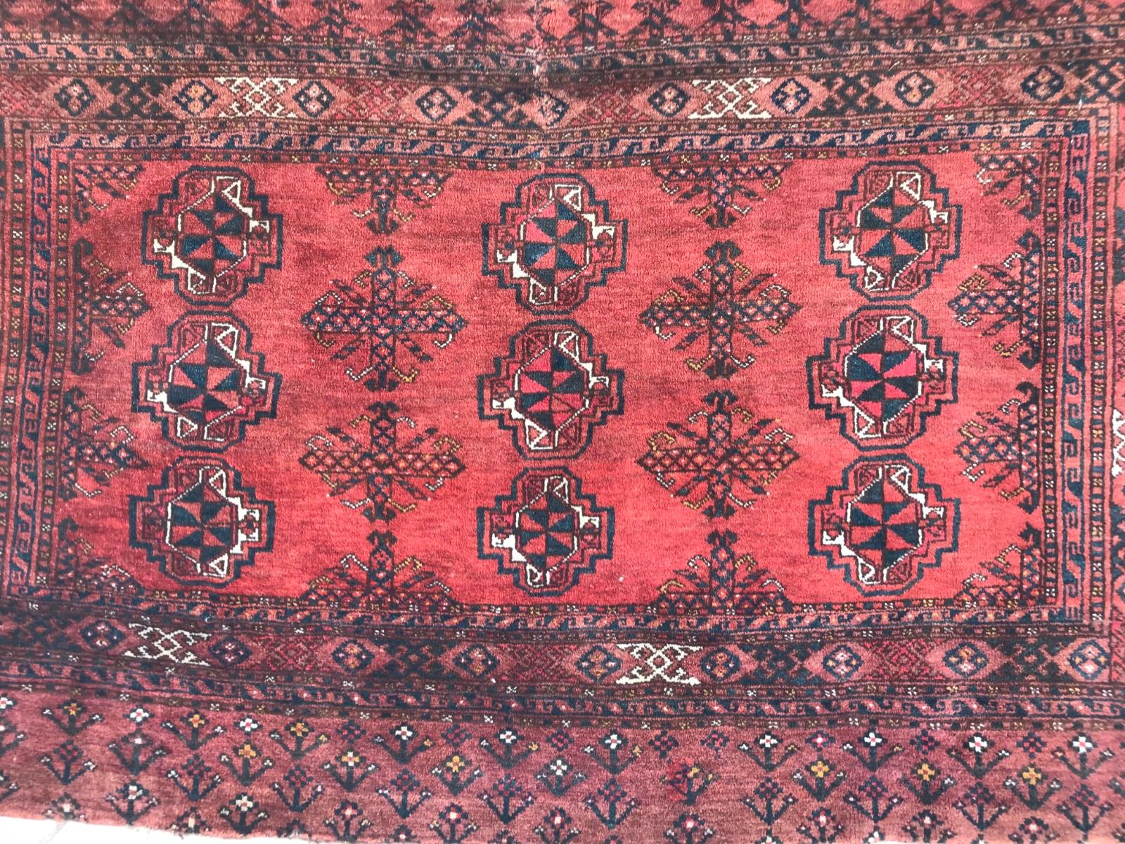 A very beautiful antique Turkmen horse cover rug with nice Boukhara design and a natural red color field, entirely hand knotted with Wool velvet on wool foundation.