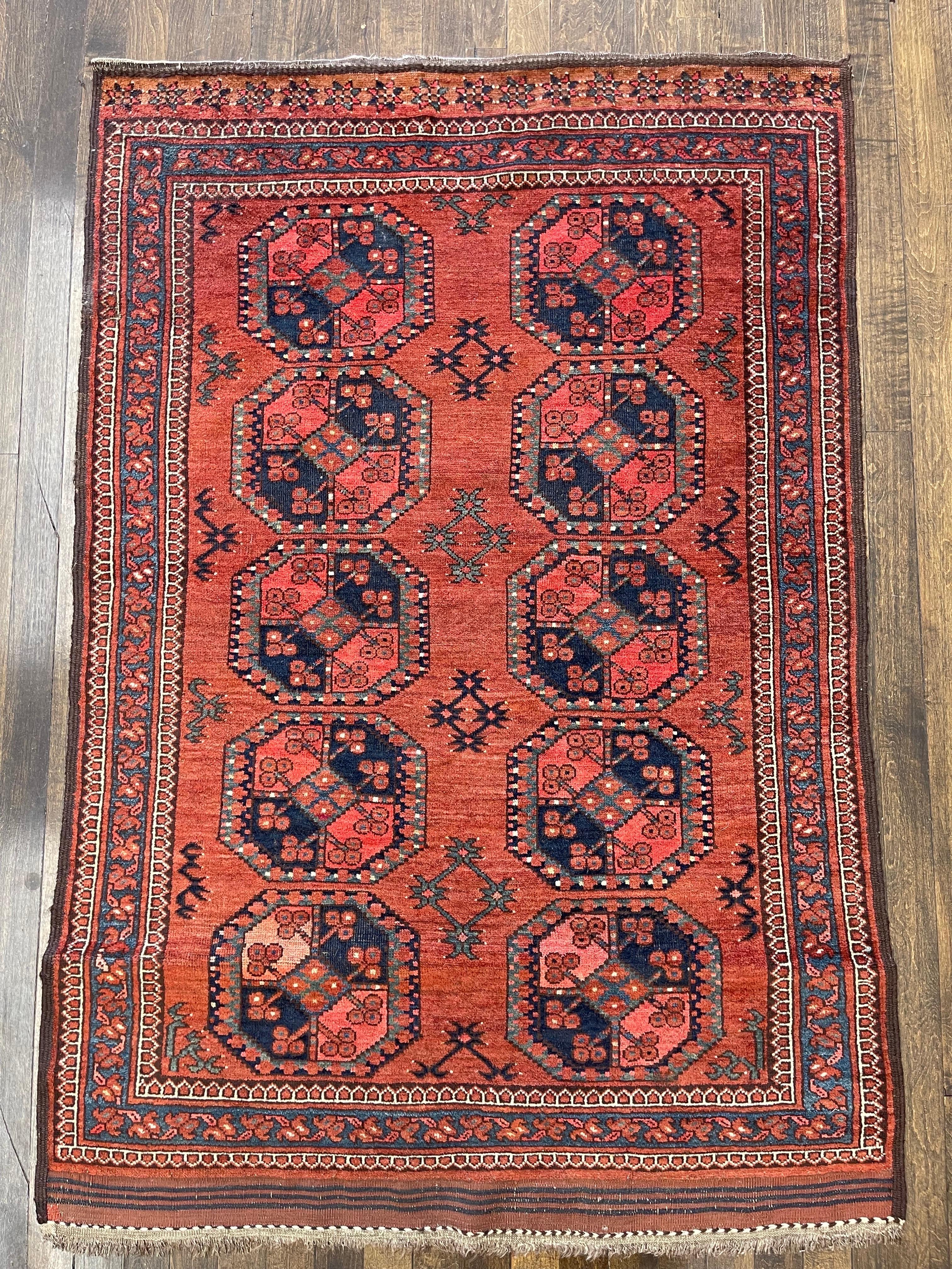A cute gorgeous hand knotted antique Ersari rug,this piece remained us of an exceptional example of the upholding of the original characteristics and represents the best of Turkman woven art.The great richness of coloring,the originality of the
