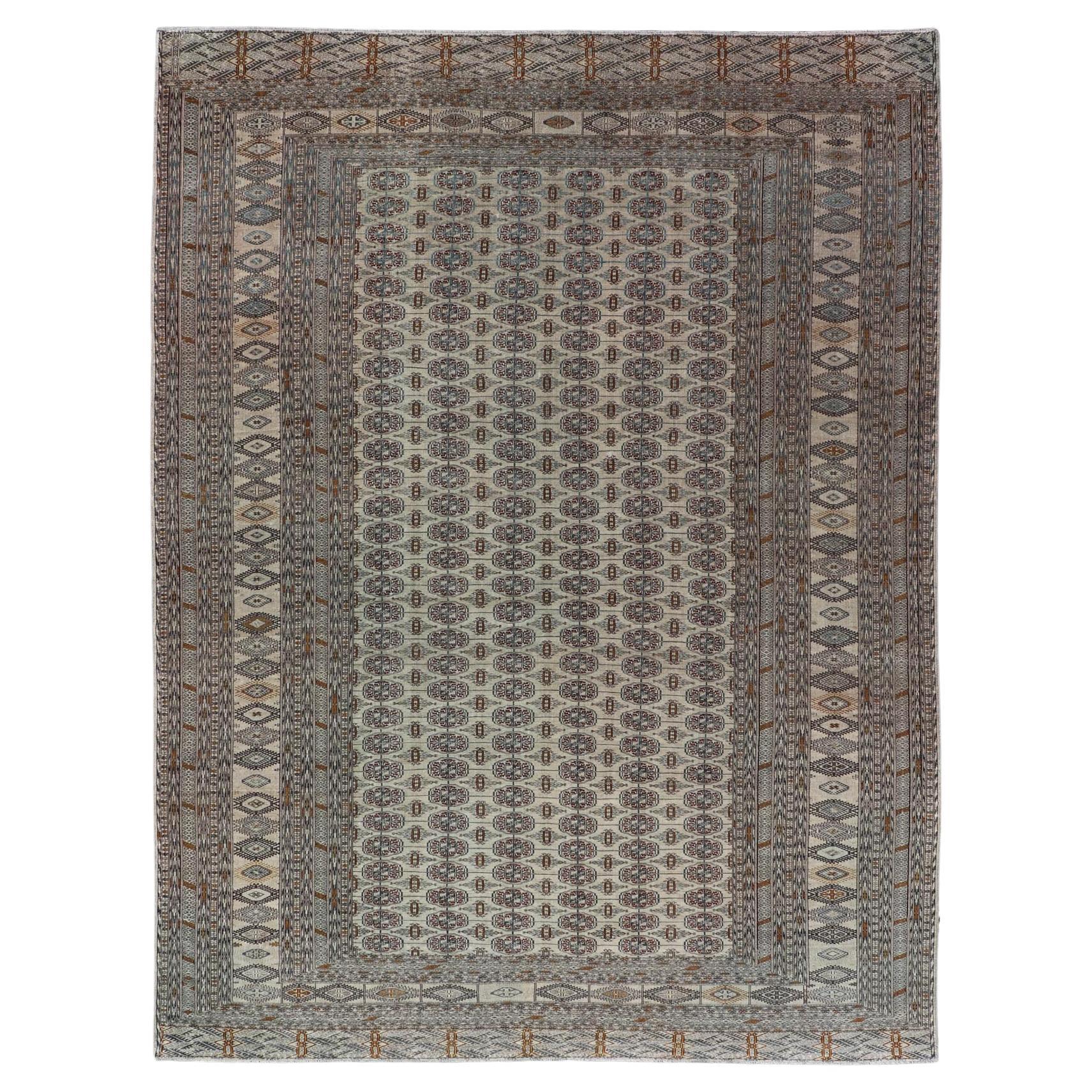 Antique Turkmen Esari Rug with Ivory Field and Repeating Motifs For Sale