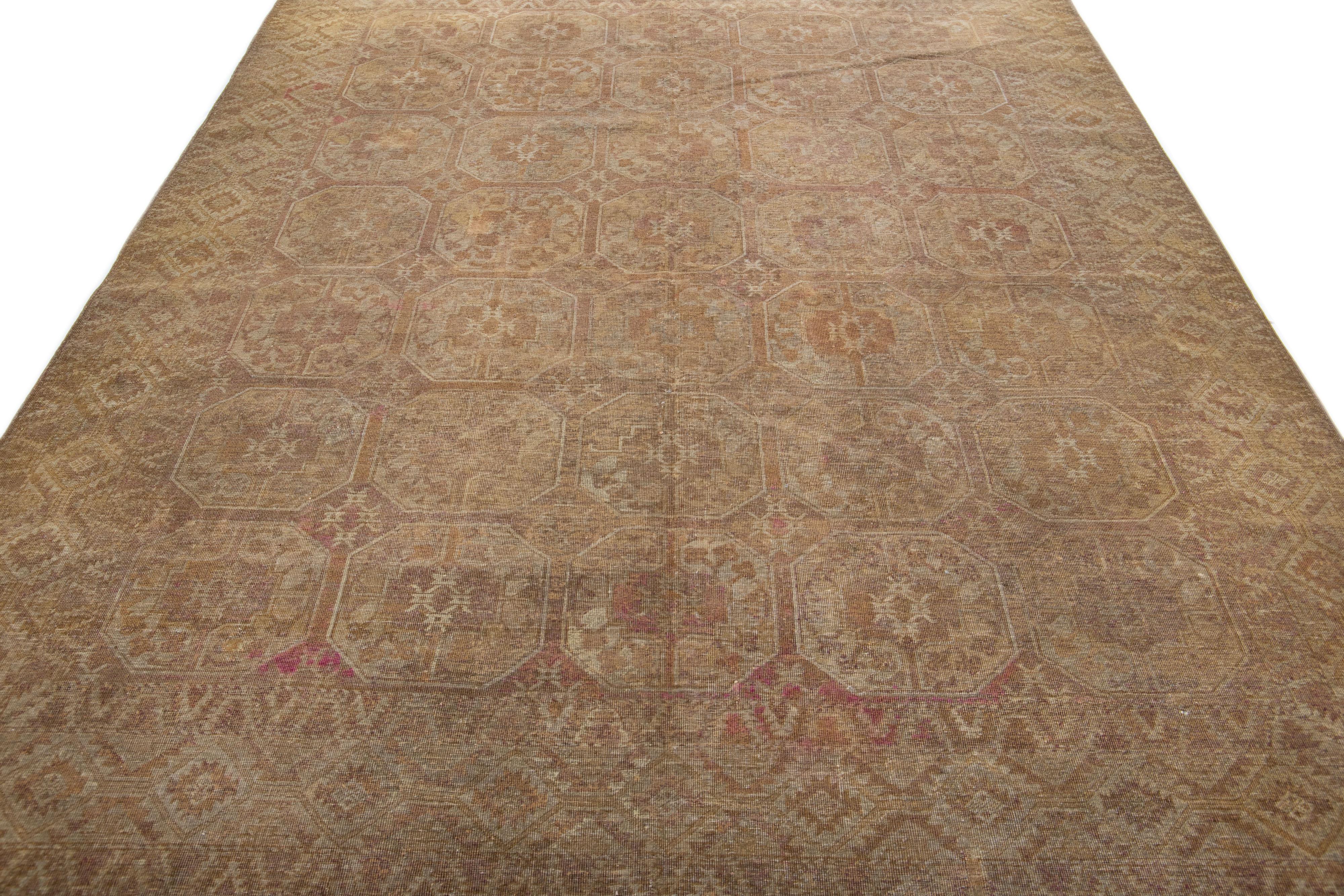 Beautiful antique Turkmen hand-knotted wool rug with a brown color field in a gorgeous all-over Gul pattern design.

This rug measures: 7'9