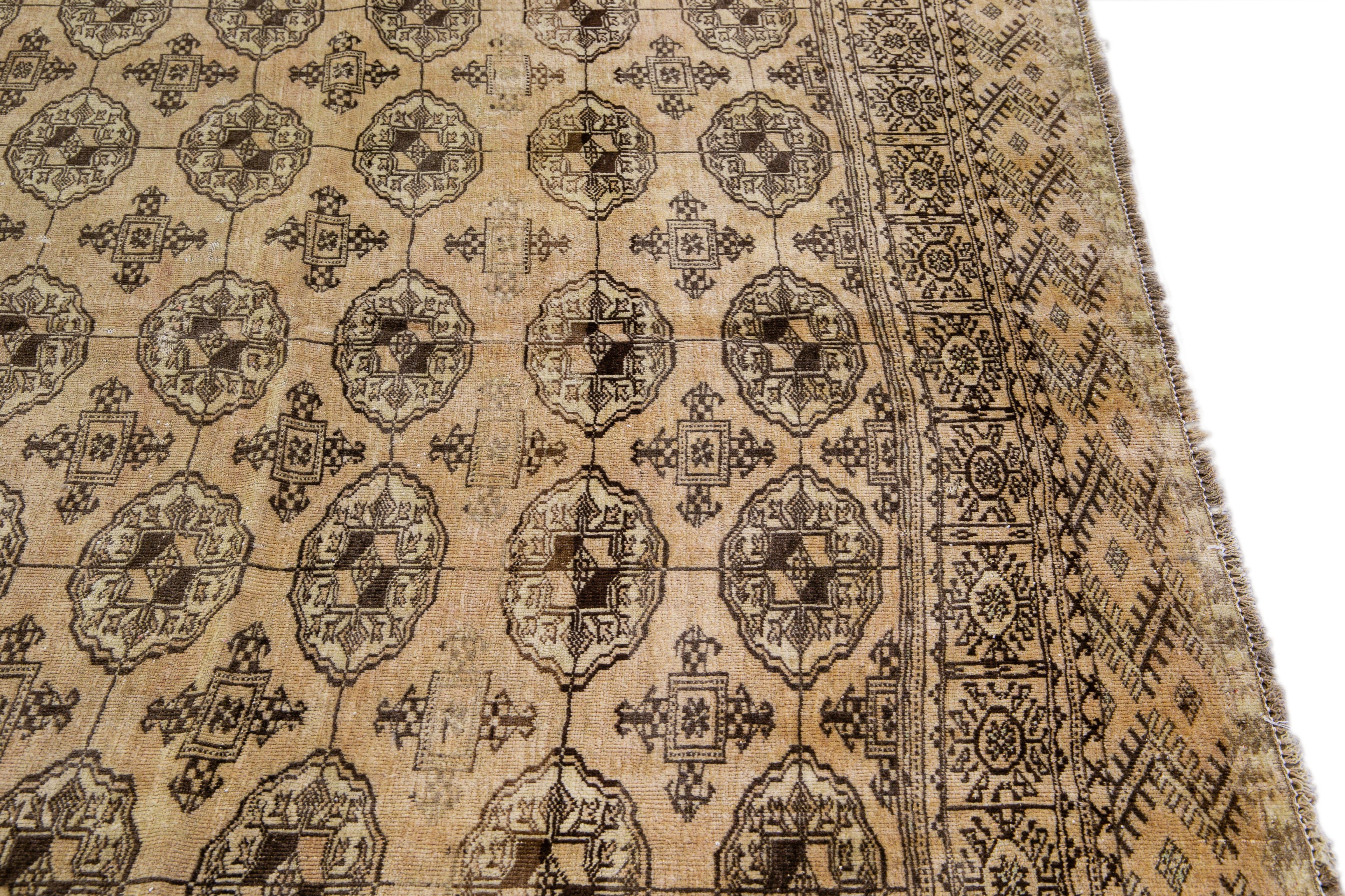 20th Century Antique Turkmen Handmade Geometric Pattern Beige Wool Rug For Sale