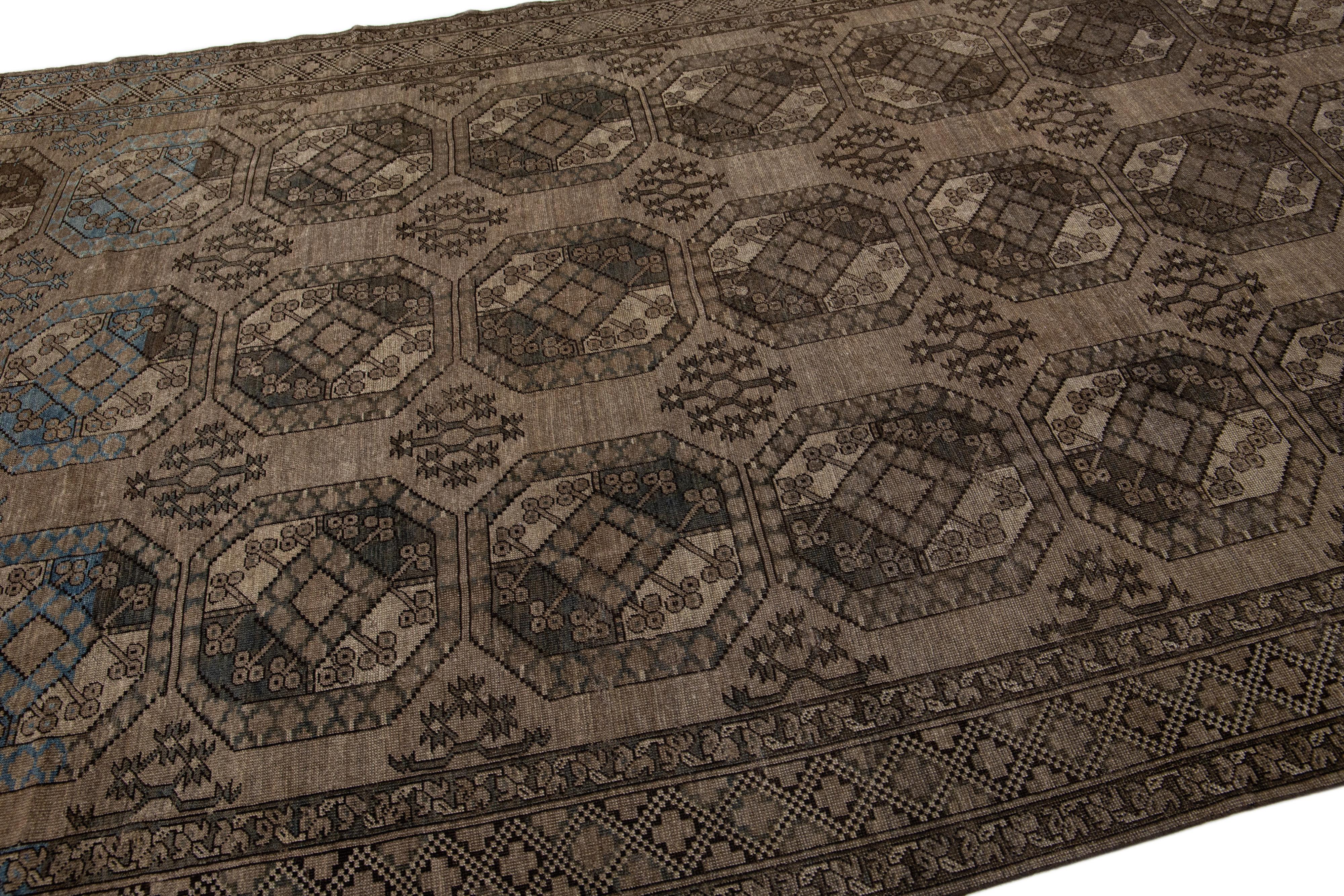 Persian Antique Turkmen Handmade Wool Brown Rug with Gul Design For Sale