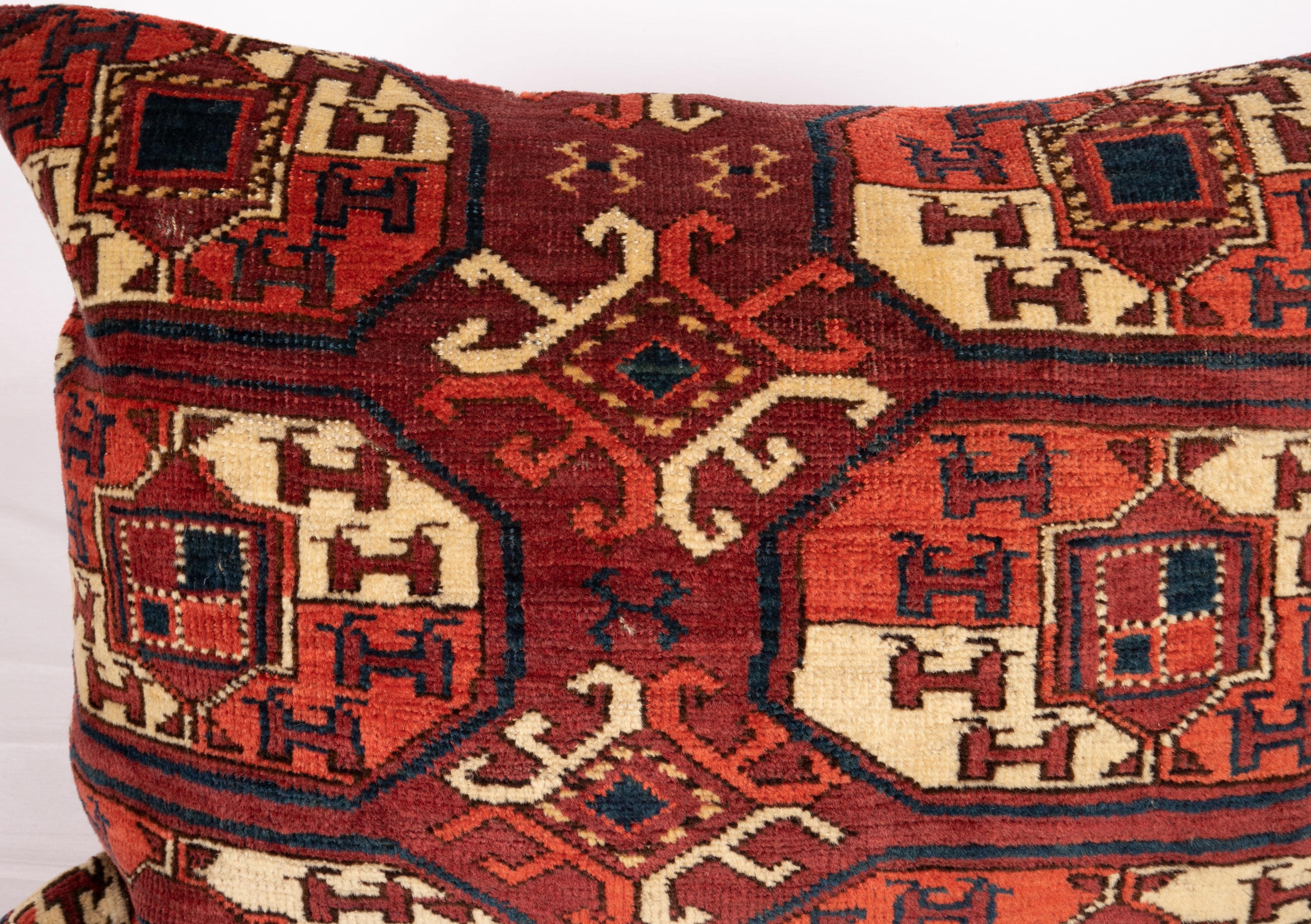 The rug is an Ersari tribe main rug.
It does not come with an insert but a bag made to the size to accommodate insert materials.
Linen in the back.
Zipper closure.
 