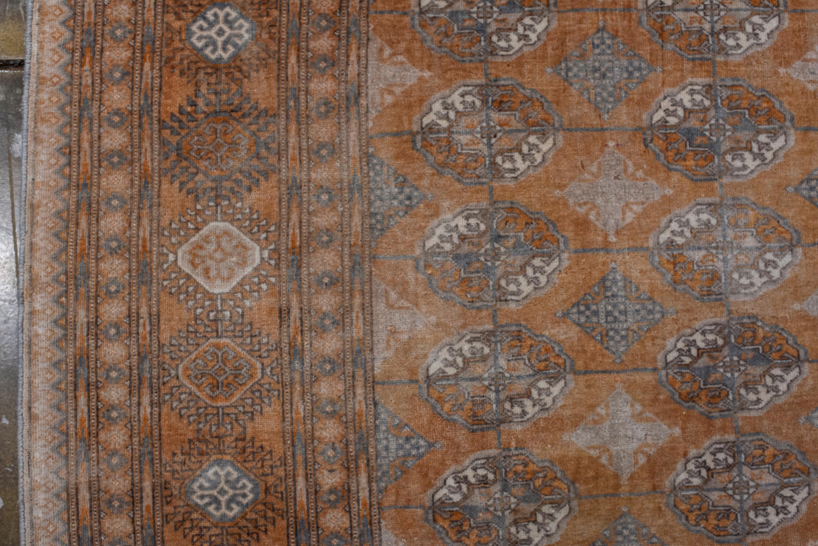 20th Century Antique Turkmen Rug with a Rust Field and a Wide Main Border For Sale