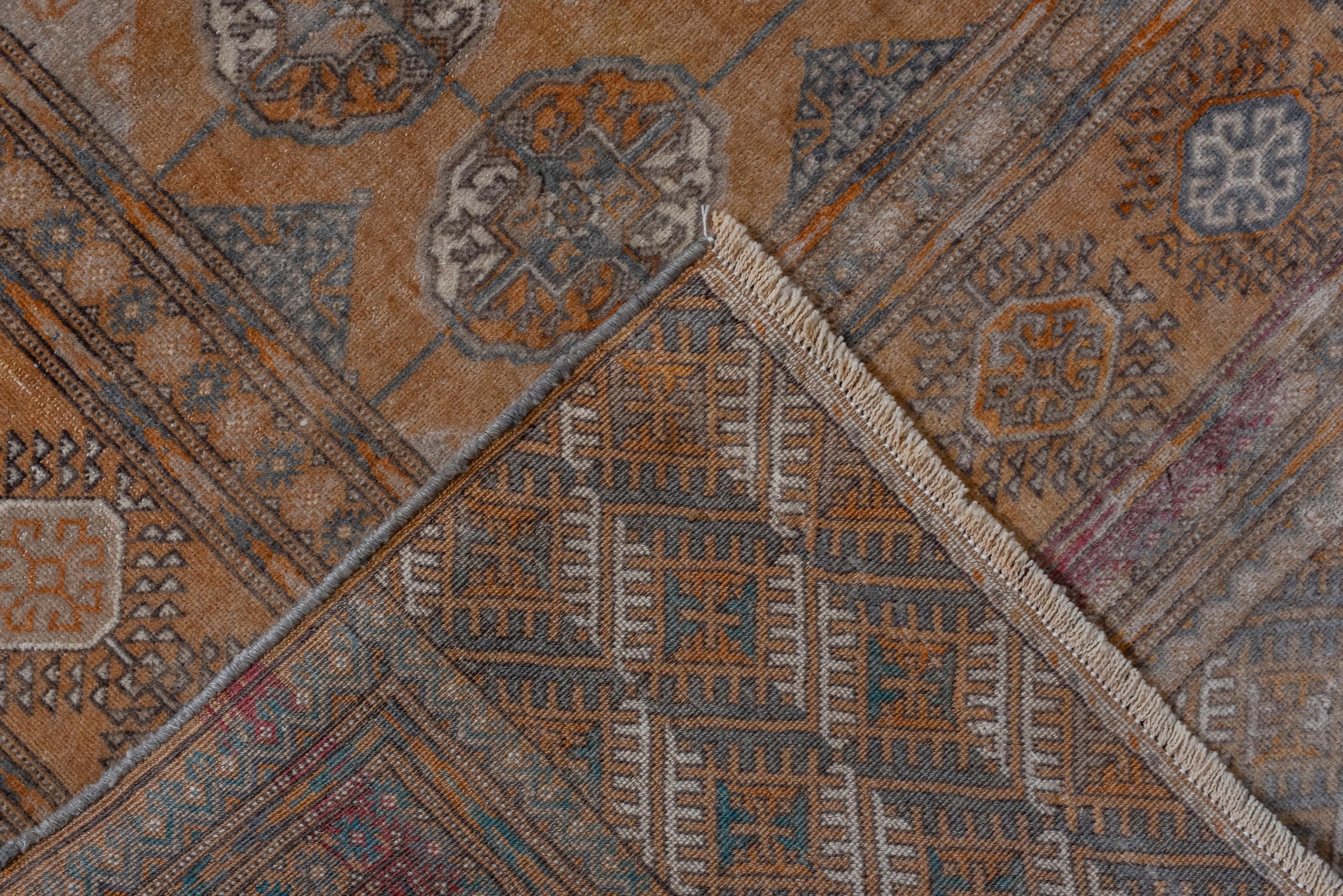 Wool Antique Turkmen Rug with a Rust Field and a Wide Main Border For Sale
