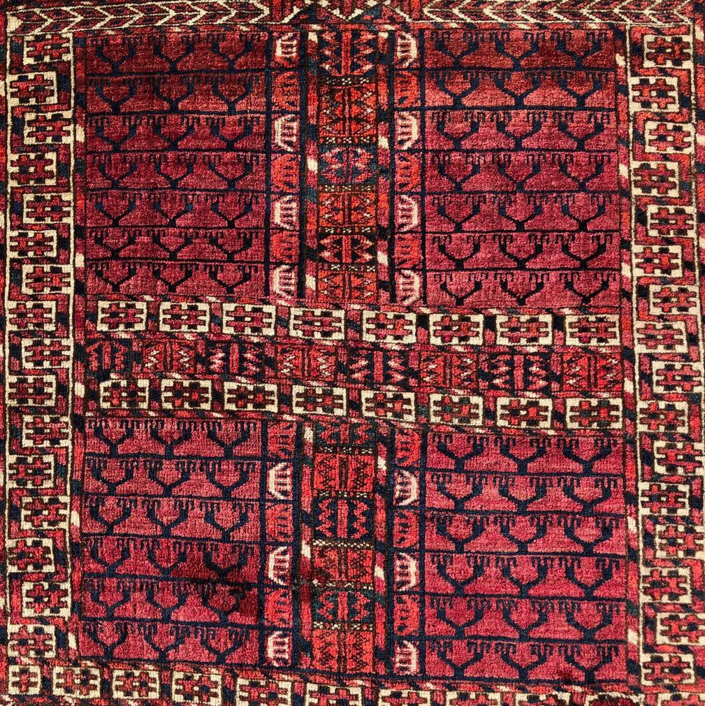 Antique Turkmen Tekke “Princess Bokhara” Hatchli Prayer Rug / Door Hanging (Ensi), Afghanistan.
A fine natural dyed wool in a dense Persian knot in thick pile on an an all wool foundation. A traditional directional Hatchli design of a repeat