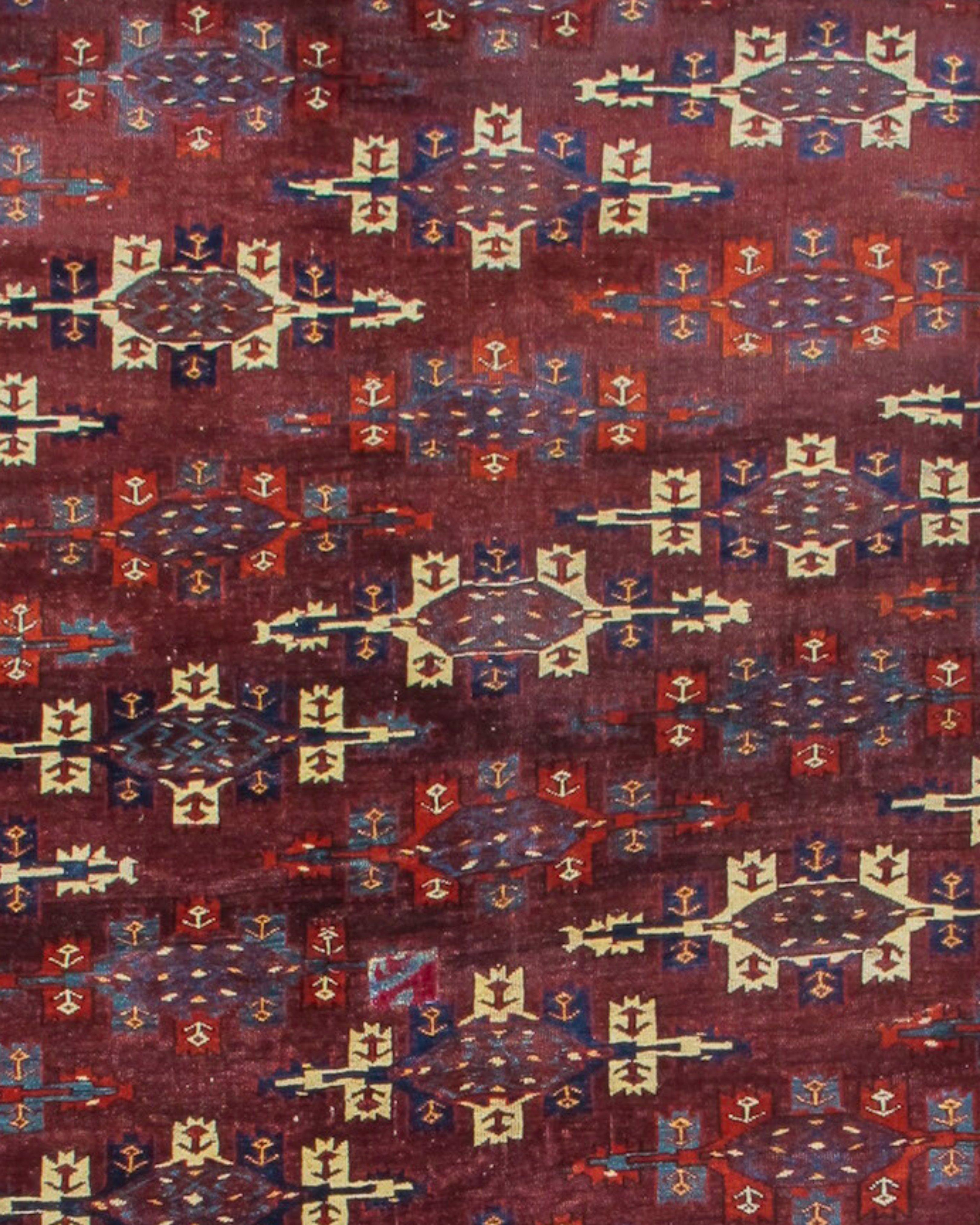 Antique Turkmen Yomut Main Carpet Rug, 19th Century

This classic Turkmen main carpet uses the so-called ‘kepse gul’ field design against a saturated plum madder ground. Elongated ‘kepse guls’ are drawn diagonally across the field alternating with