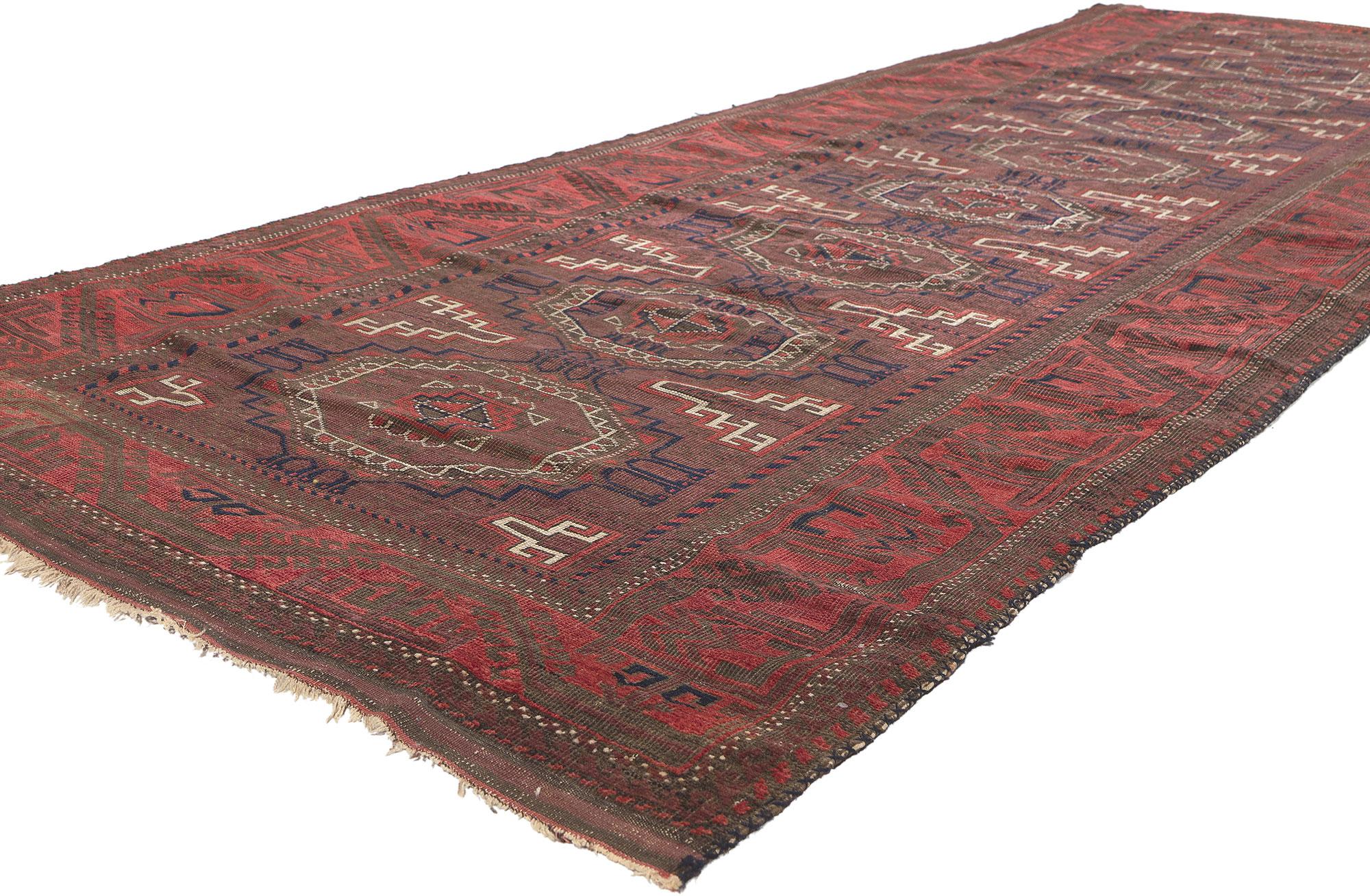 78673 Antique Turkoman Afghan Rug Runner, 04'00 x 11'09. Experience the allure of nomadic heritage intertwined with laid-back luxury in this hand-knotted wool antique Turkoman Afghani rug. Rooted in a history steeped in the traditions of Afghan