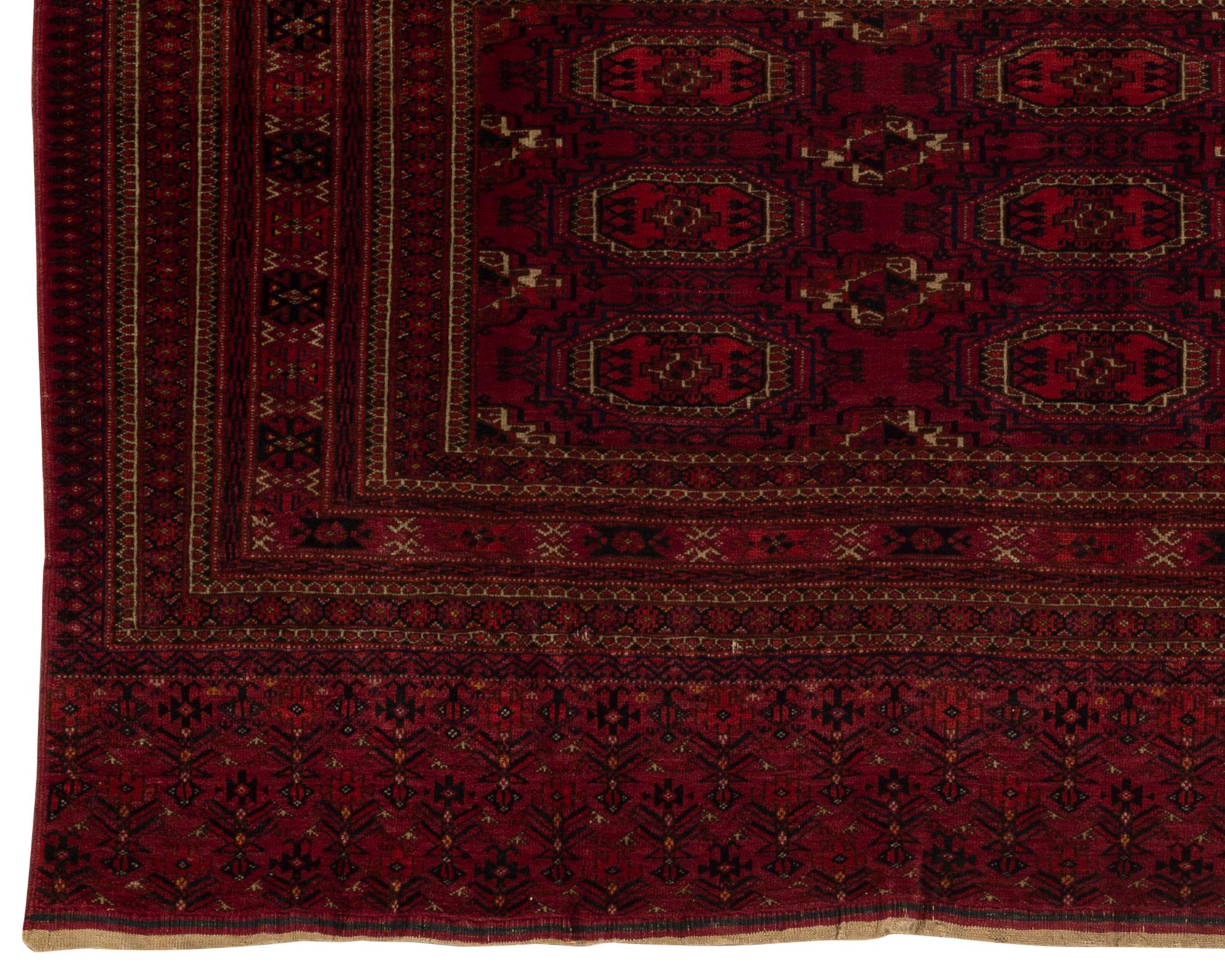 Antique Turkoman rug, circa 1890. A Turkoman or Turkmen rug from Turkmenistan formerly part of the Soviet Union. These are tribal rugs easily identifiable by their colors and the ethnic symbols used in the weavings. This lovely small rug is a