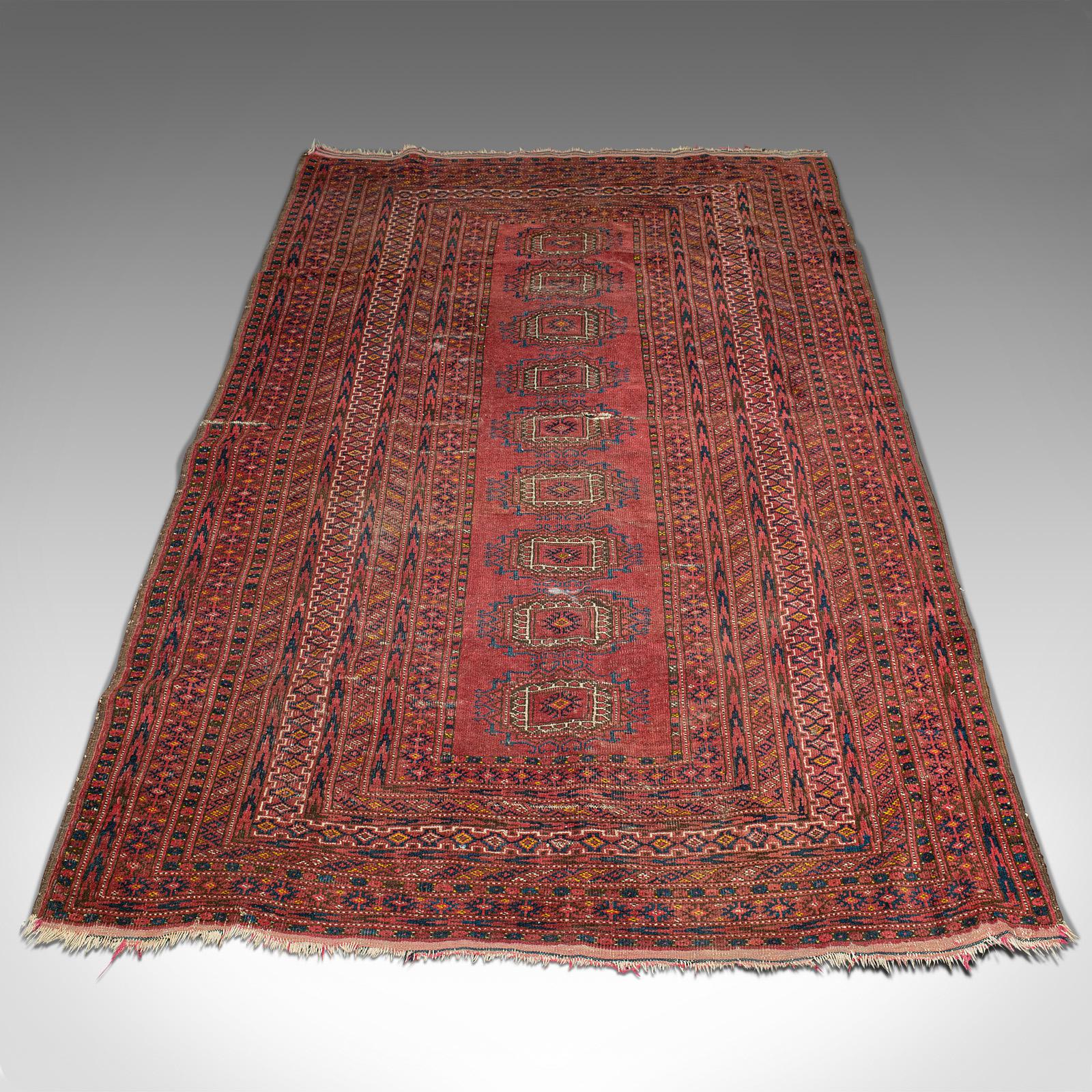 This is an antique Turkoman rug. A Middle Eastern, woven decorative carpet, dating to the early 20th century, circa 1920.

Endearing antique rug with pattern detail enthusiastic detail
Of dozar size at 120.5cm x 215cm (47.5