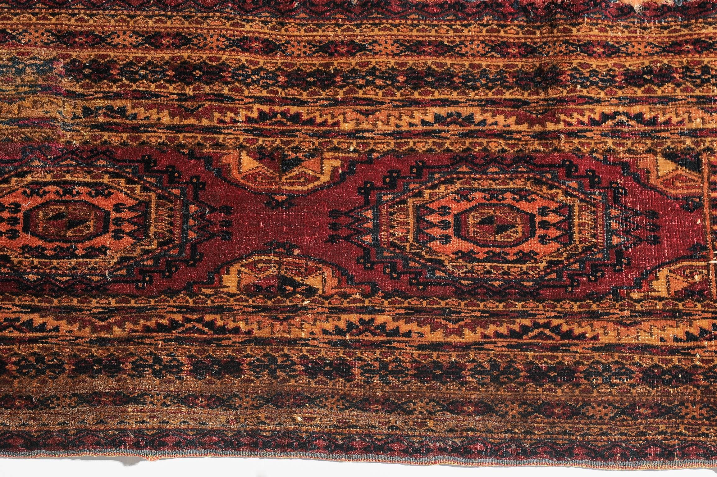 Antique rare Turkoman Torba bag with guls (roses) used by Turkoman tribes.
There are many books on the whole history of these famous little nomadic carpets. This one is perfect for wall, naturally, because it is intact rare still with its fringes.