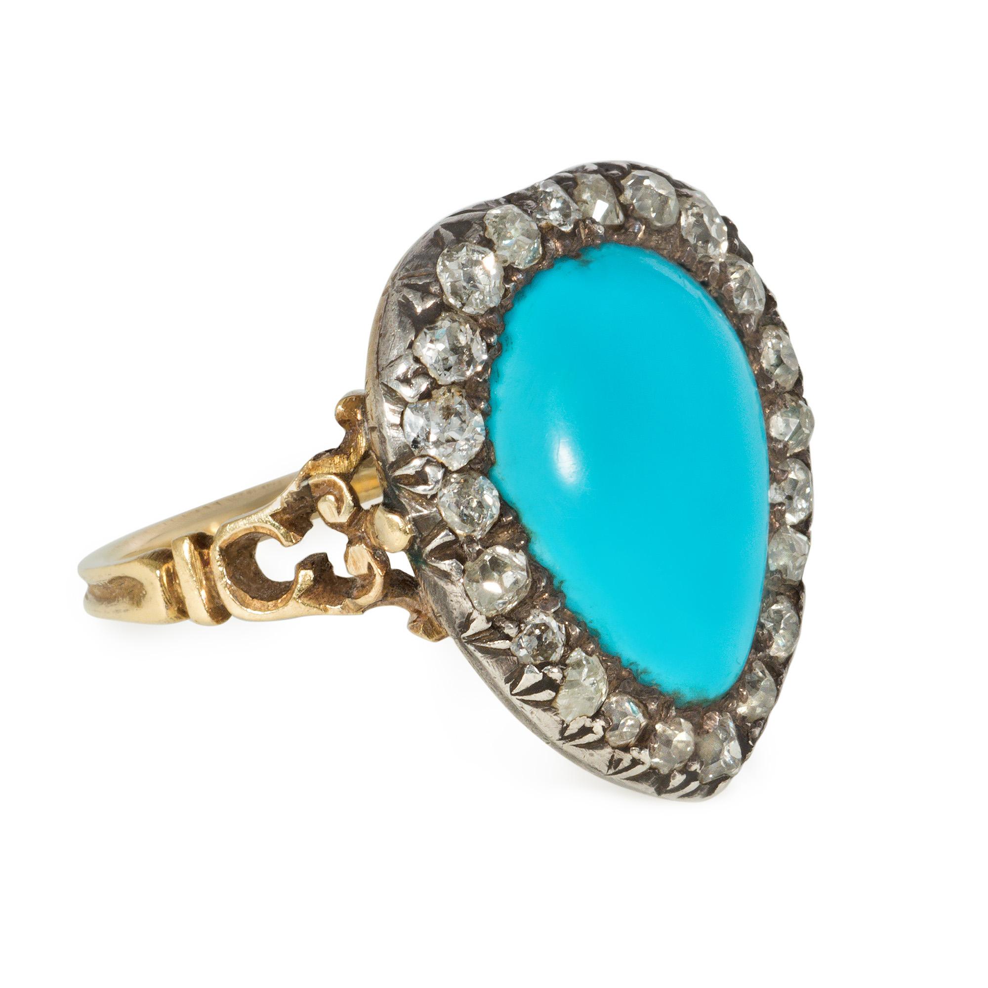 An antique Georgian era turquoise and diamond ring designed as a stylized heart comprised of a pear-shaped turquoise in an old-mine diamond surround with openwork shoulders, in silver and 18k gold.  Atw diamonds 1.00 ct.  Face-up: 2 cm x 1.8 cm

*