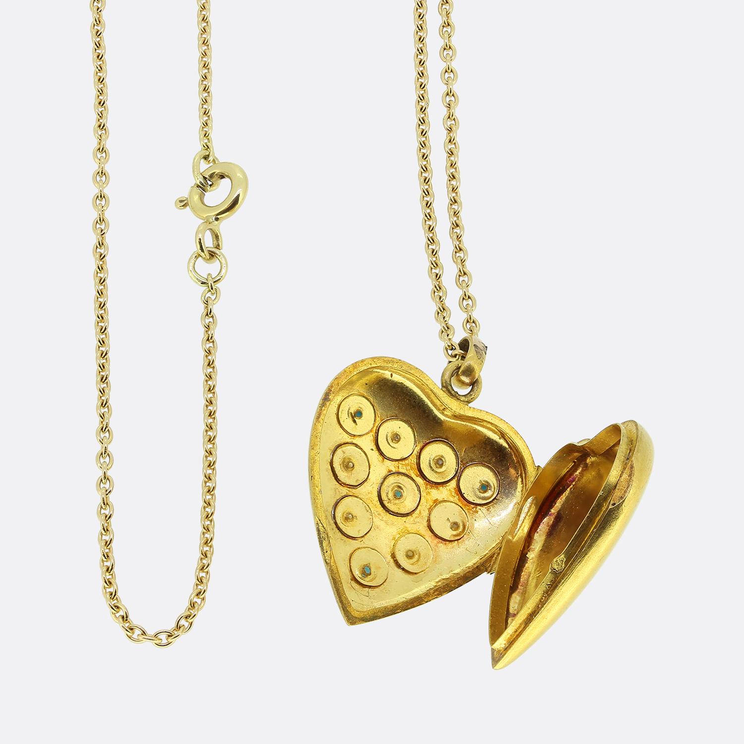 Here we have a charming locket necklace. This antique locket has been crafted from a rich 20ct yellow gold into the shape of a love heart. The body has then been set with wonderful array of individually star-burst set round turquoise and seed