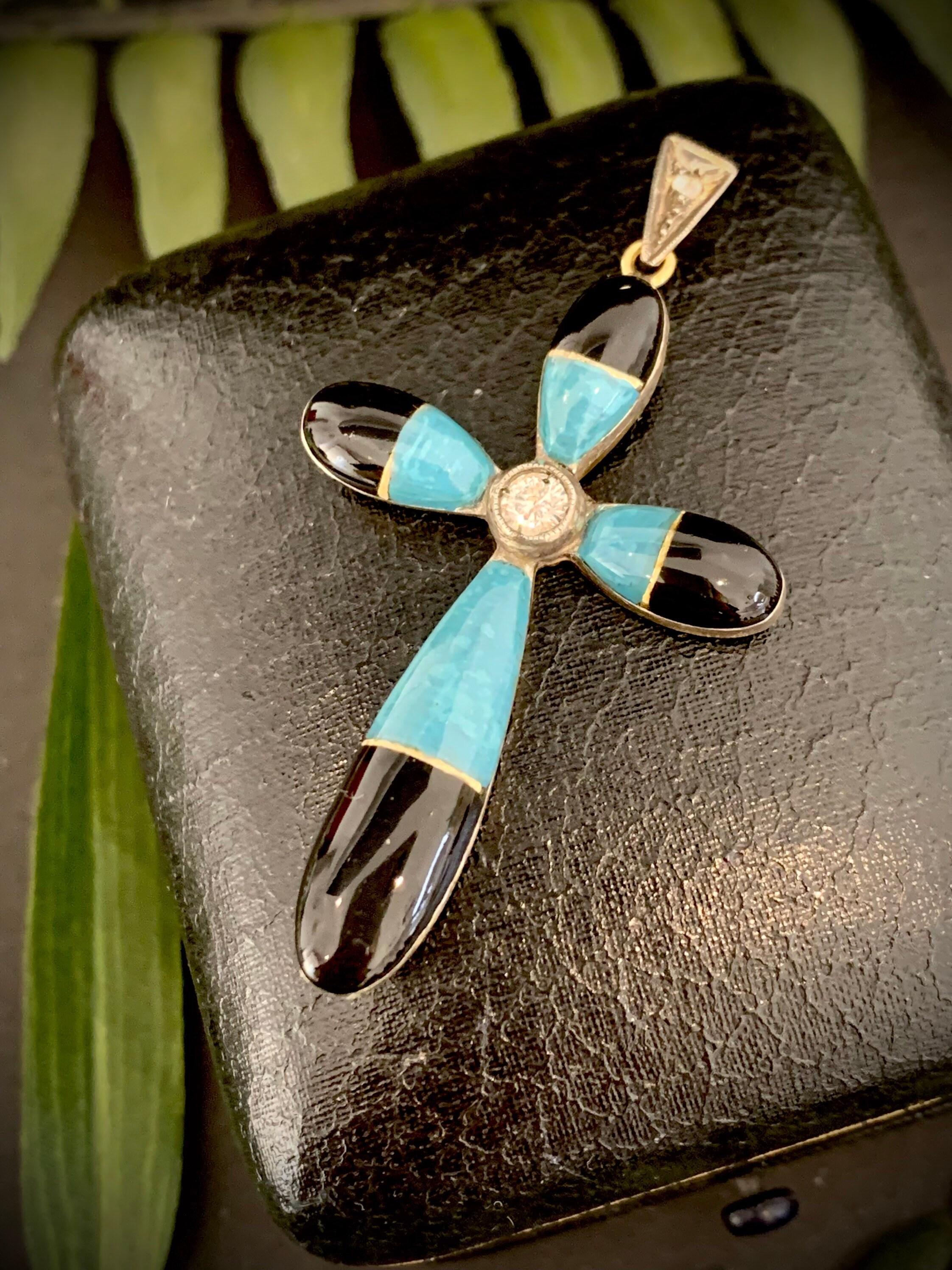 Antique Turquoise & Enamel Cross Pendant 

Circa 1920’s 

18ct Gold 

Set with Fabulous Black Enamel & Turquoise With a Diamond Centre Stone & Diamond Bail

Measures Approx 52mm x 28.5mm 

*Gold Chain Additional Purchase 

All of our items are