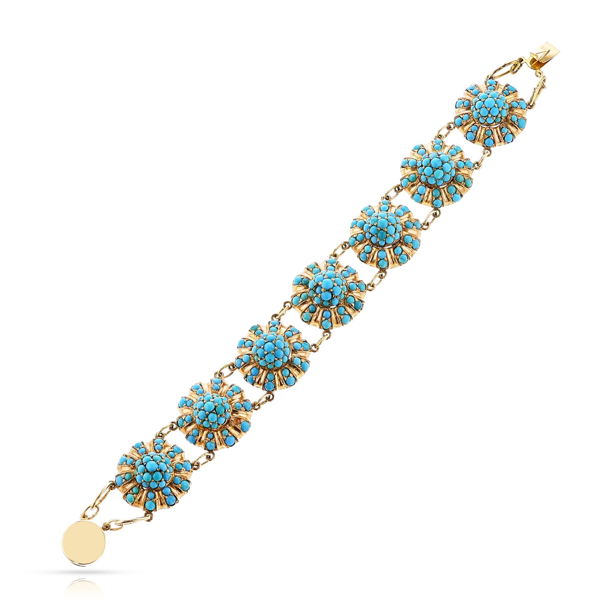 An Antique Turquoise Flower Bracelet made in 14k Yellow Gold with turquoise cabochons. The total weight of the bracelet is 48.45 grams. The length is 5.75