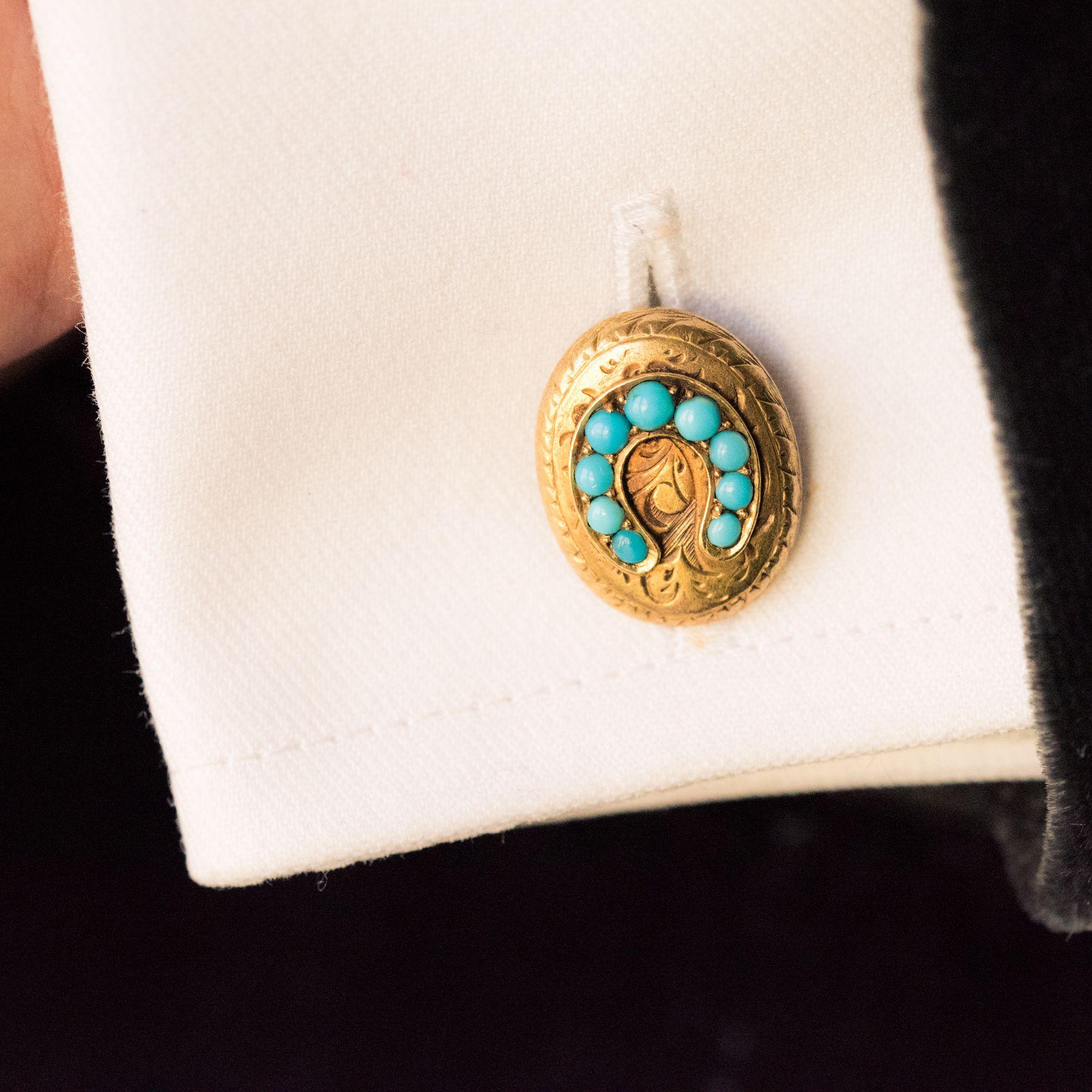 Pair of cufflinks in 18 carat yellow gold. 
Double cufflinks, the exterior design of each gold cufflink is in an engraved oval shape featuring a horseshoe set with turquoise cabochons. The inner design is round in shape with the same design. They
