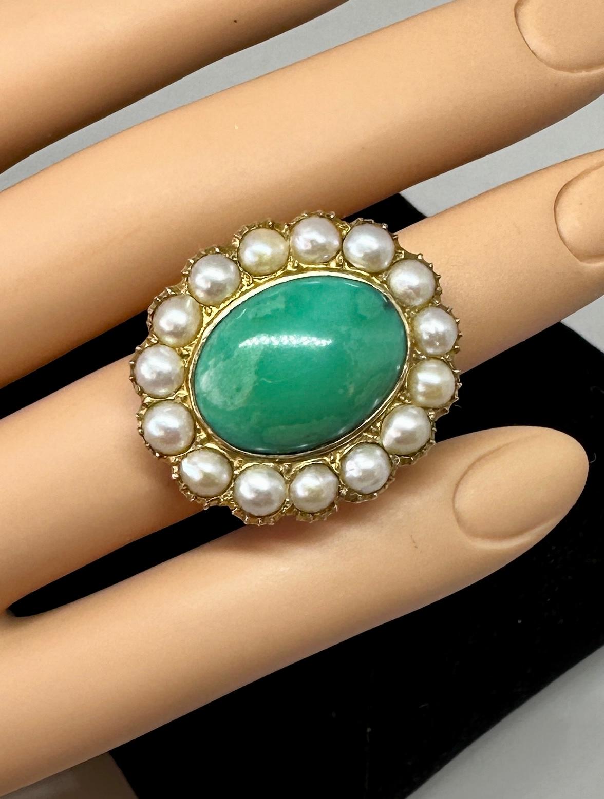 This is a gorgeous antique Turquoise Ring with a Pearl Halo.  In the center is a stunning 19mm by 14mm by 5mm Turquoise Cabochon.  The ring is from the estate of Hollywood Legend Mary Lou Daves and was a gift from her husband, the director Delbert
