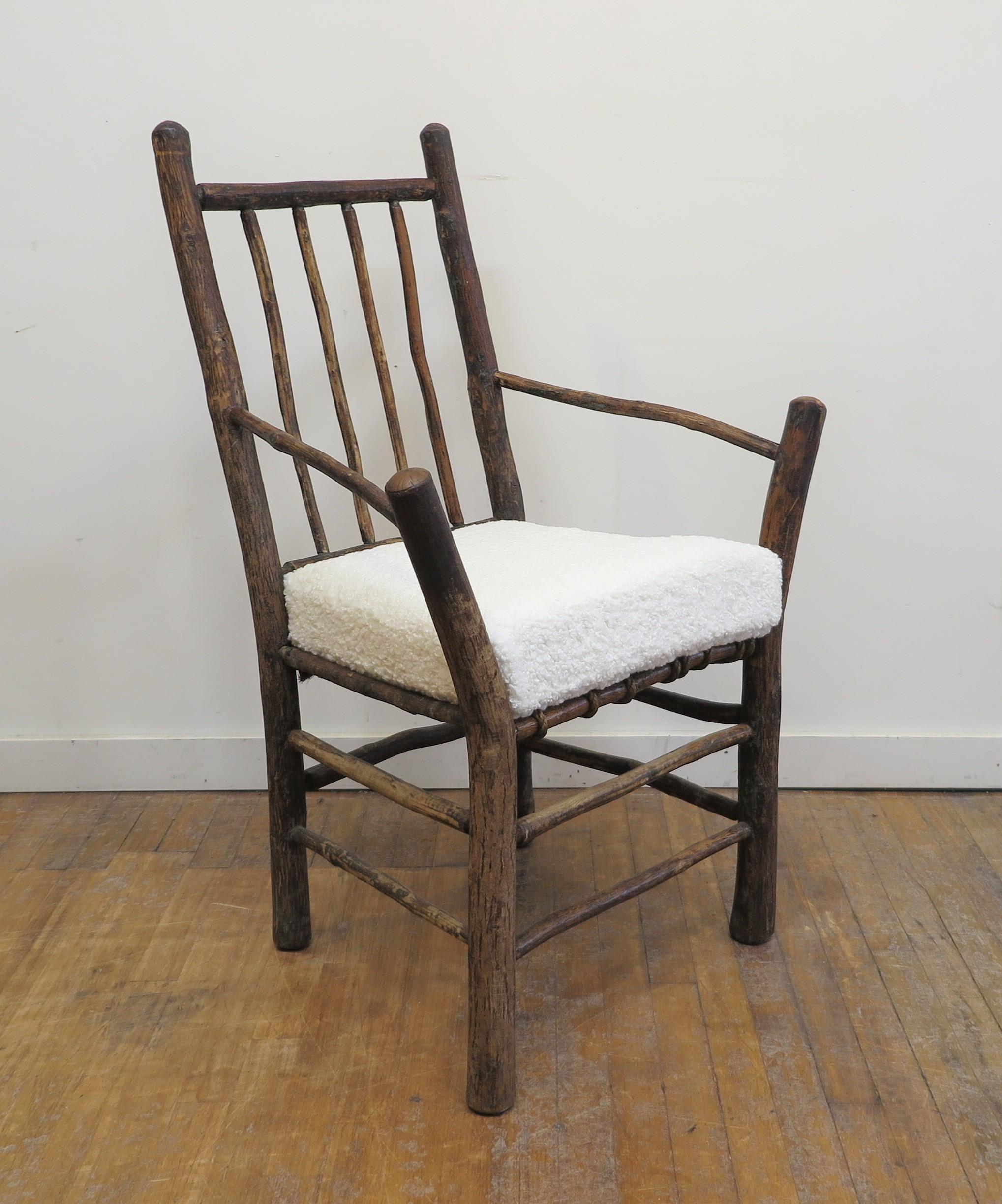Antique Twig Adirondacks Chair. Very well made example of a rustic Twig Adirondack style chair. Comfortable to sit in ergonomically, the design simple but well made. The arms splay out to the left right sides and are in good position to rest arms or