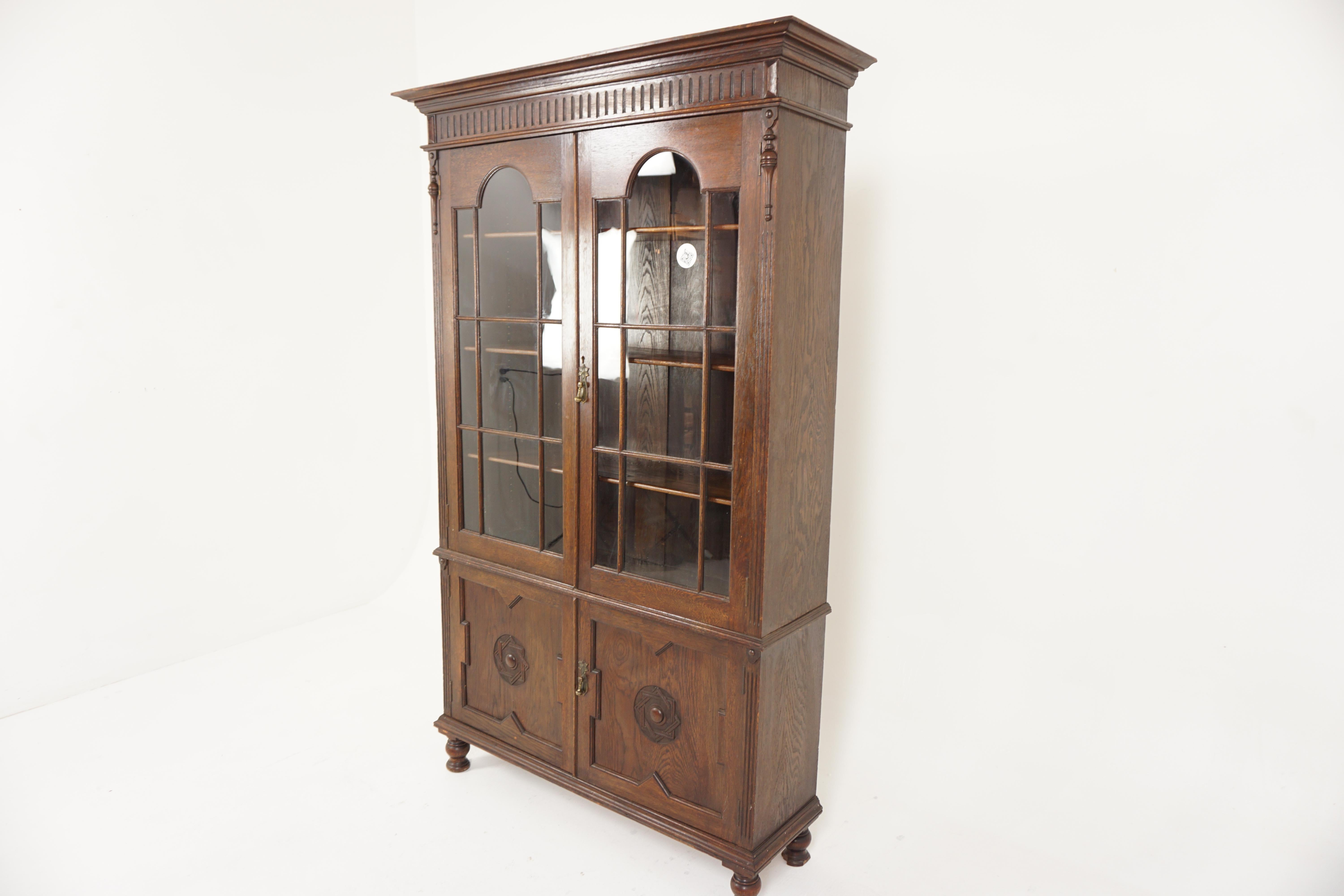 Antique Two Four Oak cabinet bookcase, display cabinet, Scotland 1910, H751

Scotland 1910
Solid Oak
Original finish
Flared out cornice on top
Carved frieze below
With a pair of original glass doors
With arched tops and moulded fronts
Three