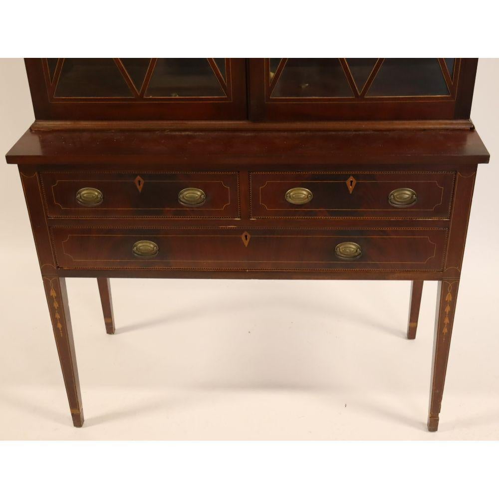 Elevate your home décor with this exquisite Early 19th Century Sheraton Style English Mahogany Wood Bookcase or Display Cabinet, crafted with timeless elegance and sophistication. Designed in the distinguished Sheraton style, this exceptional piece