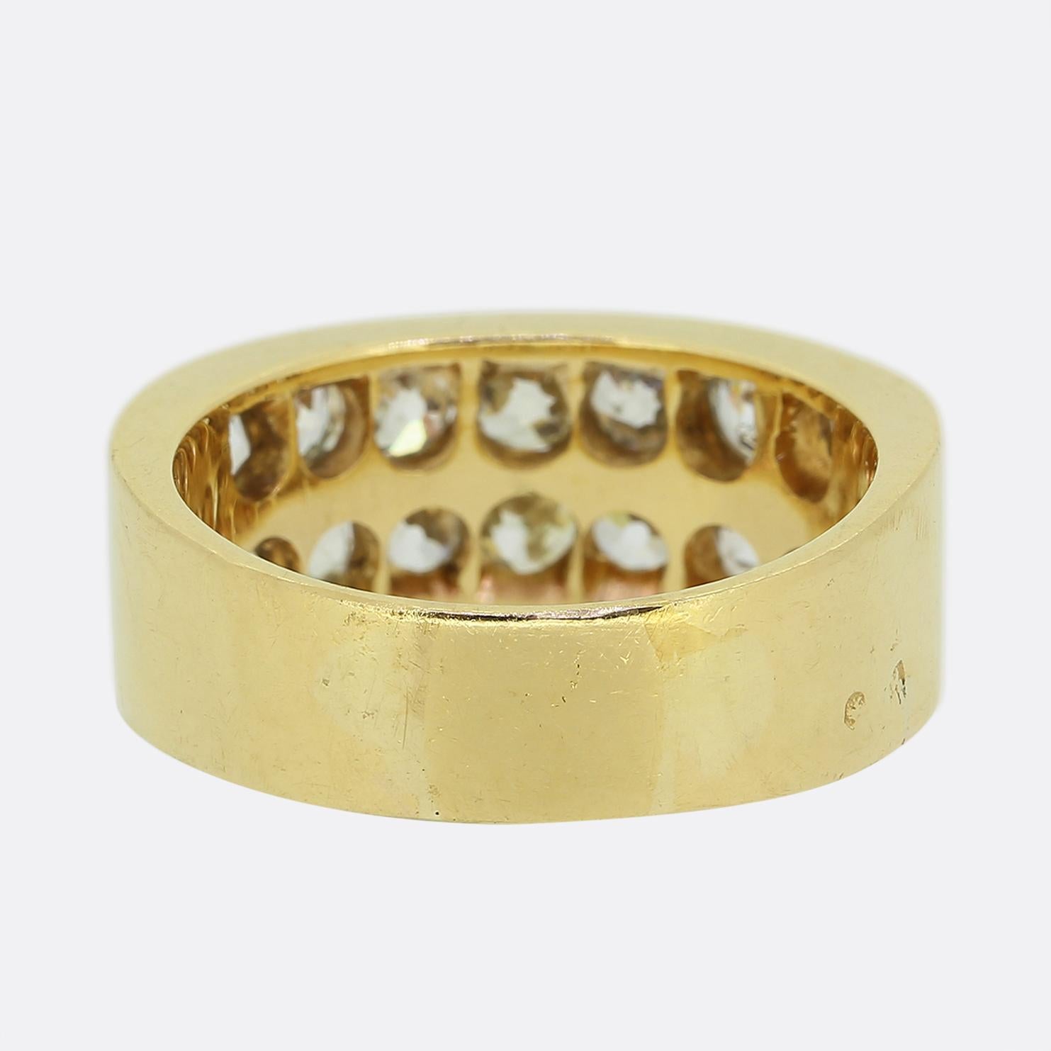 Here we have a marvellous dual row diamond cluster ring. This antique piece has been crafted from a rich 18ct yellow gold and showcases two rows of seven round faceted chunky old mine cut diamonds. This beautifully bright ring is made complete by a