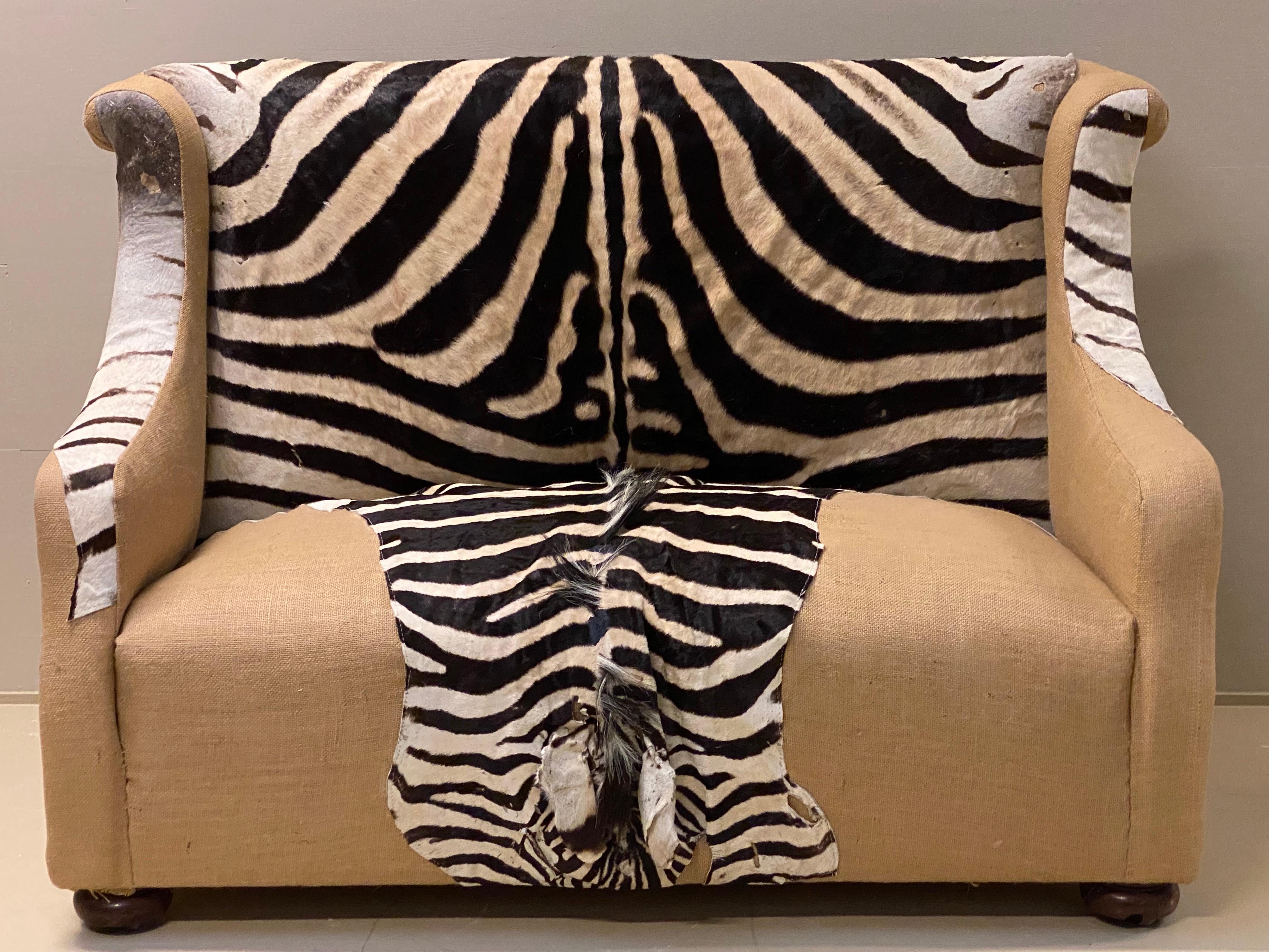 Unique Victorian two seat canape from around 1890,
fully restored and new upholstered with real Zebra Skin,
very comfortable seating, piece of character to put in the study, library or drawing room.