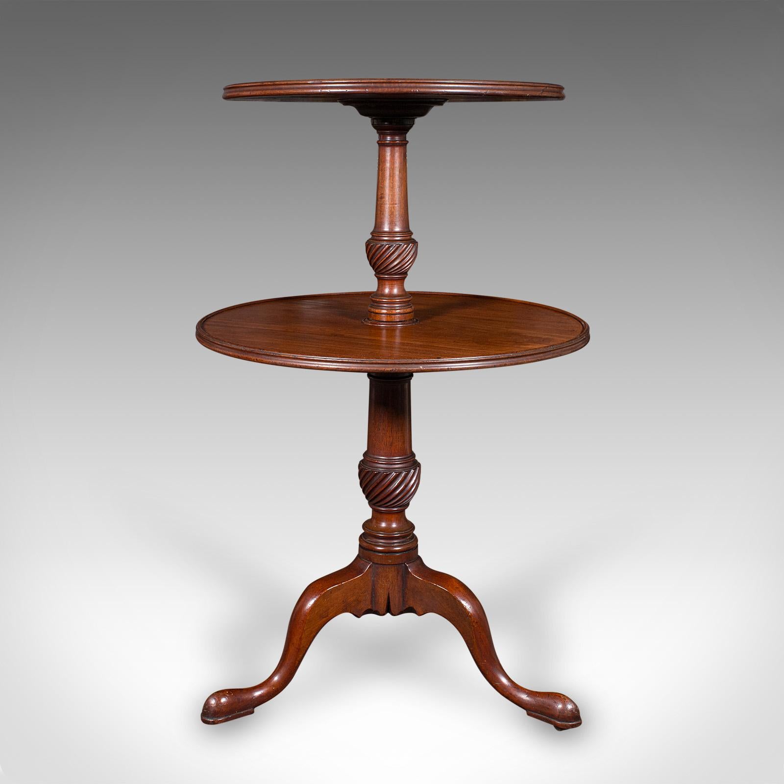 This is a fine antique two-tier dumb waiter. An English, mahogany serving or jardiniere stand, dating to the Georgian period, circa 1790. Of distinguished form and proportion, this fine example offers refined craftsmanship and a tasteful appearance