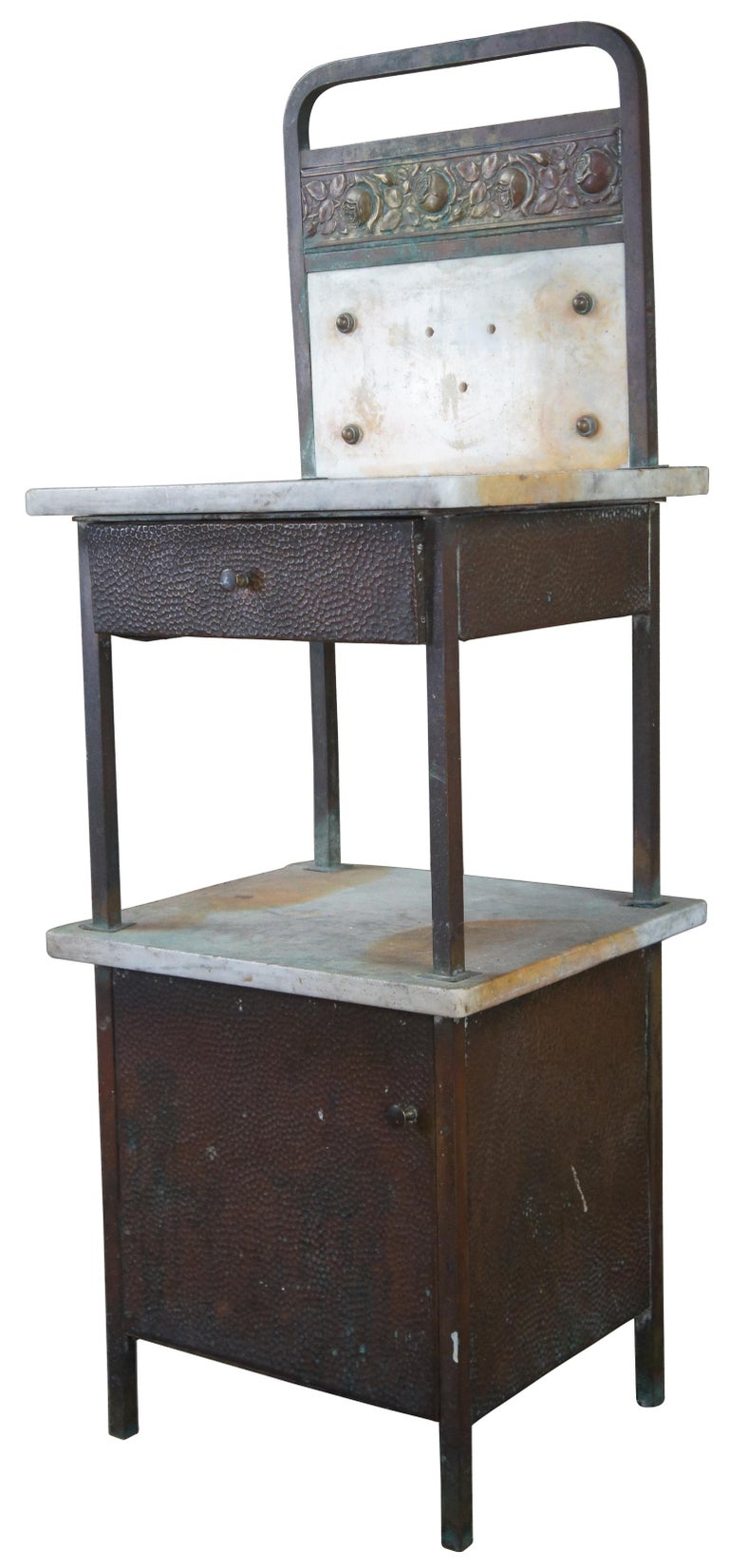 Antique two tier washstand or medical cabinet. Made of iron and marble featuring an upper drawer and lower cabinet. Measure: 46