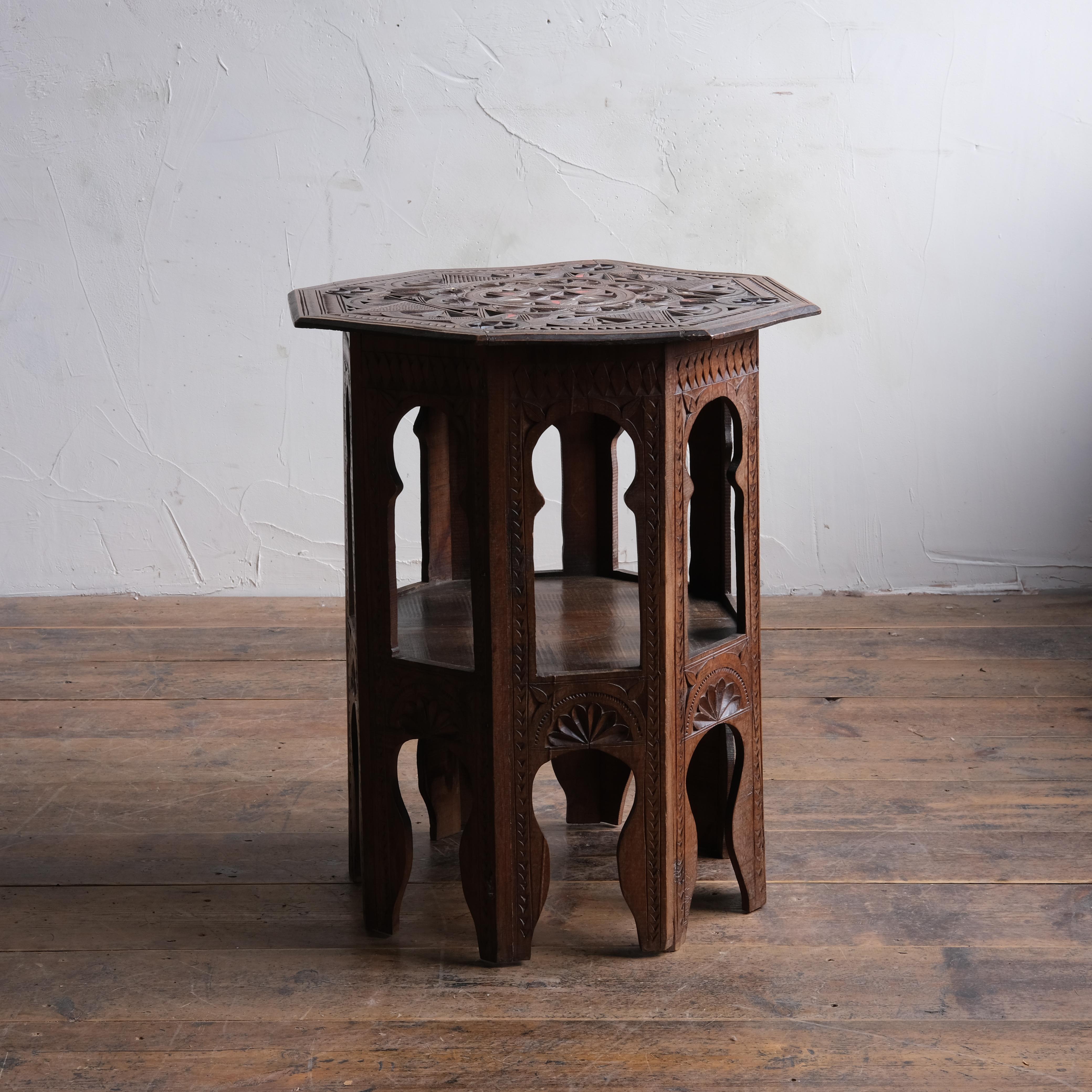 An attractive Moorish side table with carved details throughout. Mother of pearl inlays and brass to the top. Of good scale and In good solid order.
58x58cm wide

66cm high.