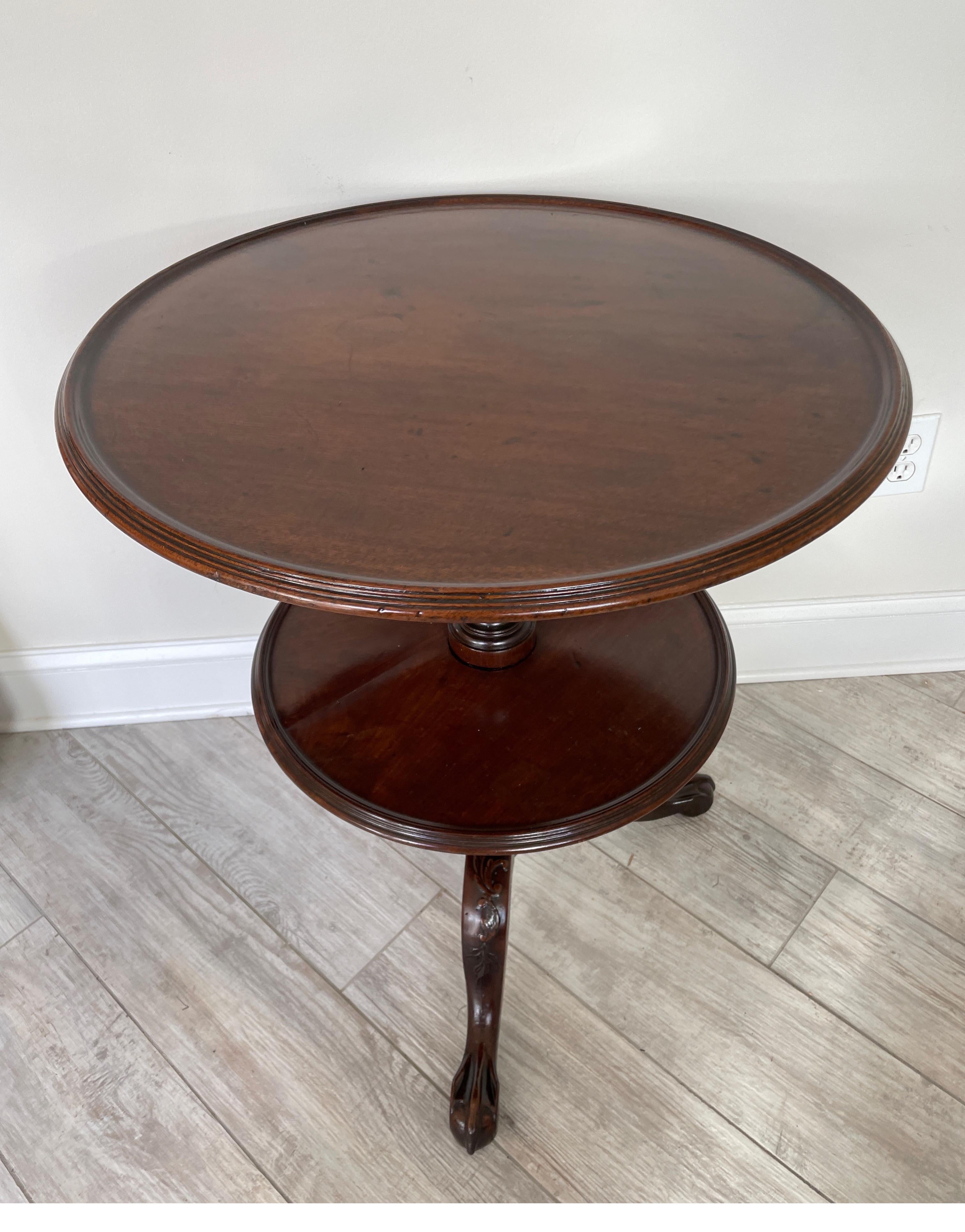 Antique two tiered English lazy Susan side table. The top tier which revolves is the larger of the two. A very fine & unique piece.