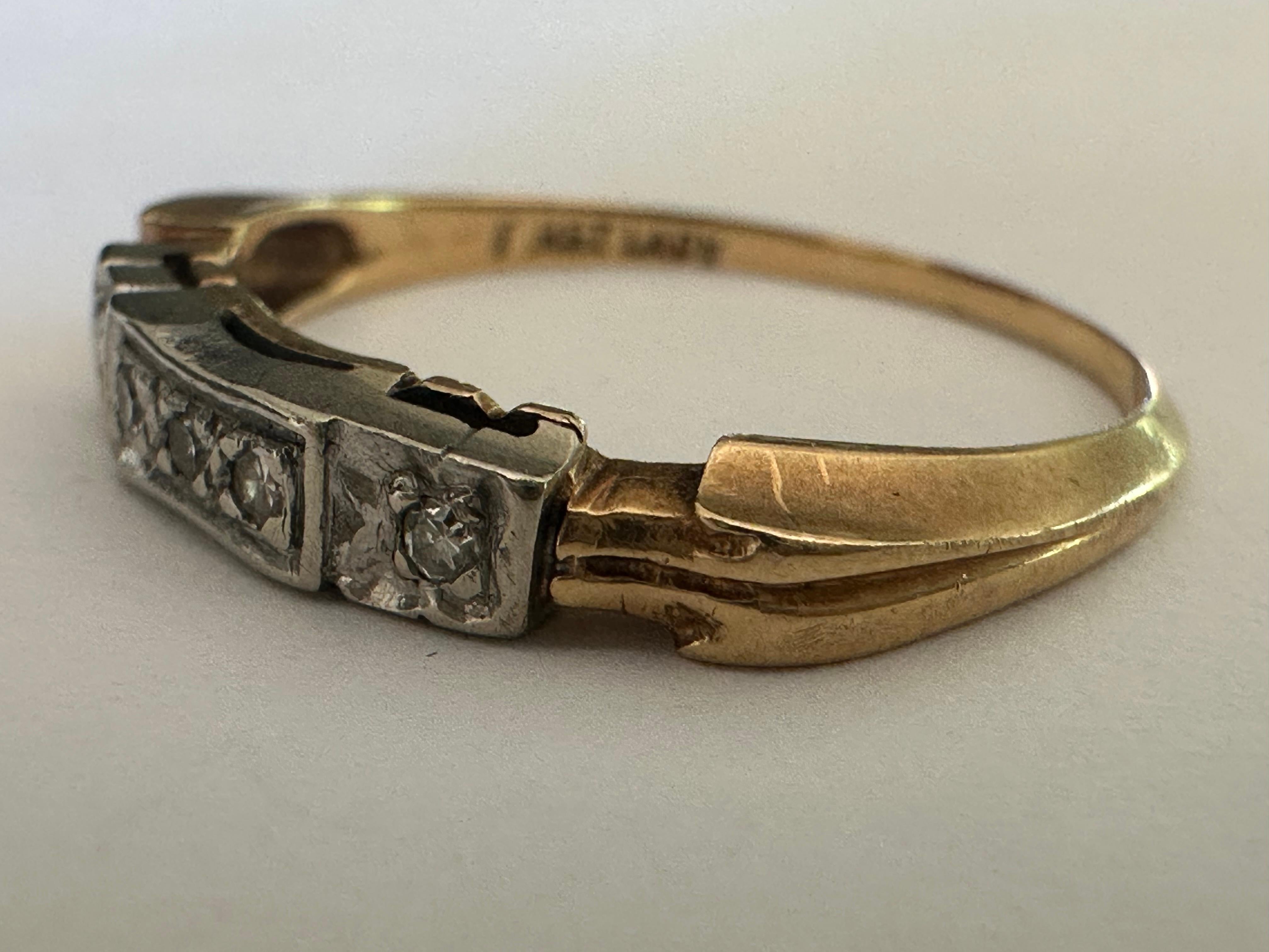 A line of five single-cut diamonds, totaling approximately 0.1 carats, adorn this antique band, most likely circa turn of the 20th century. Set in 14K yellow gold and platinum. 