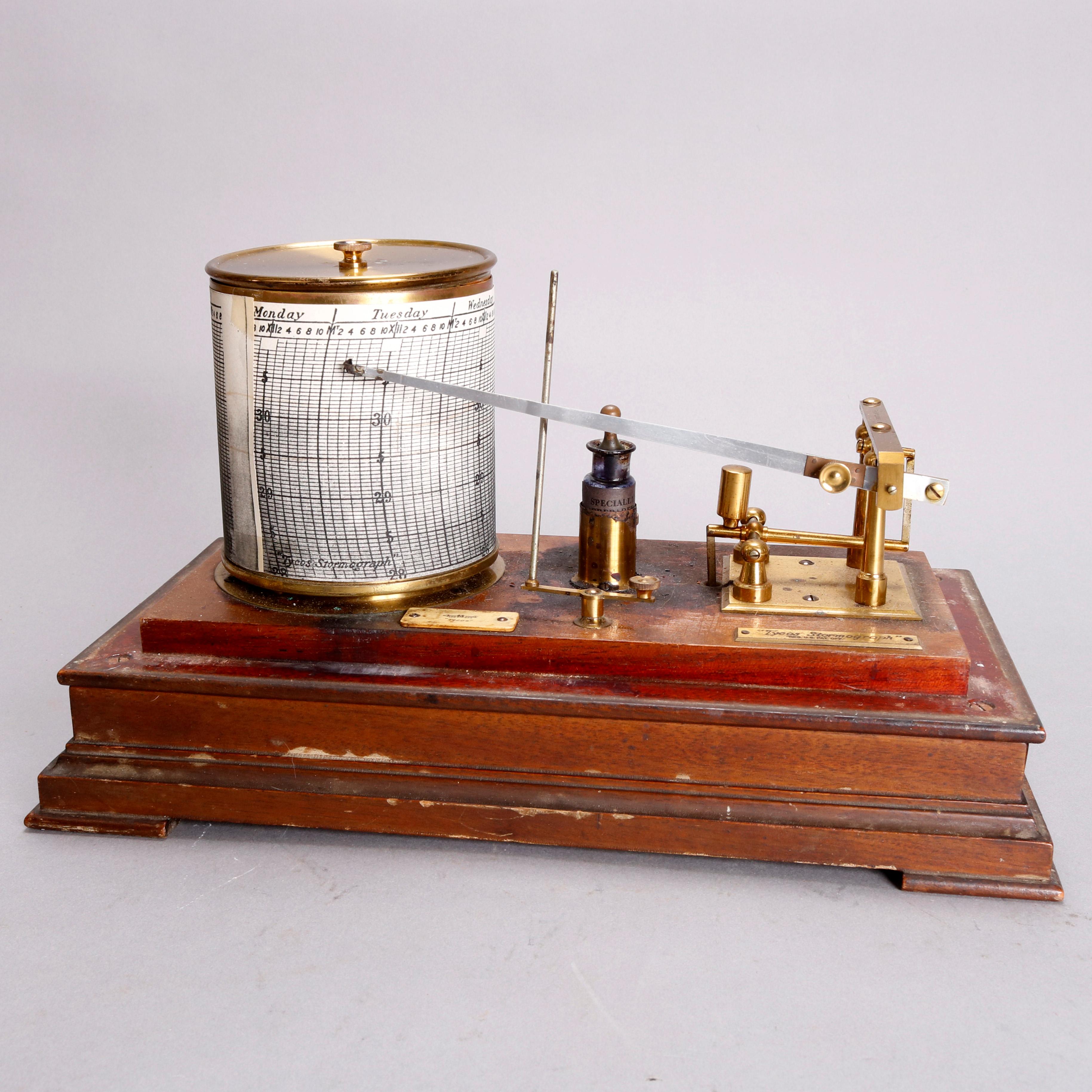 An antique Tycos Stormograph Barograph housed in oak and glass case with original engraved brass labels, circa 1890.

Measures: 7.5