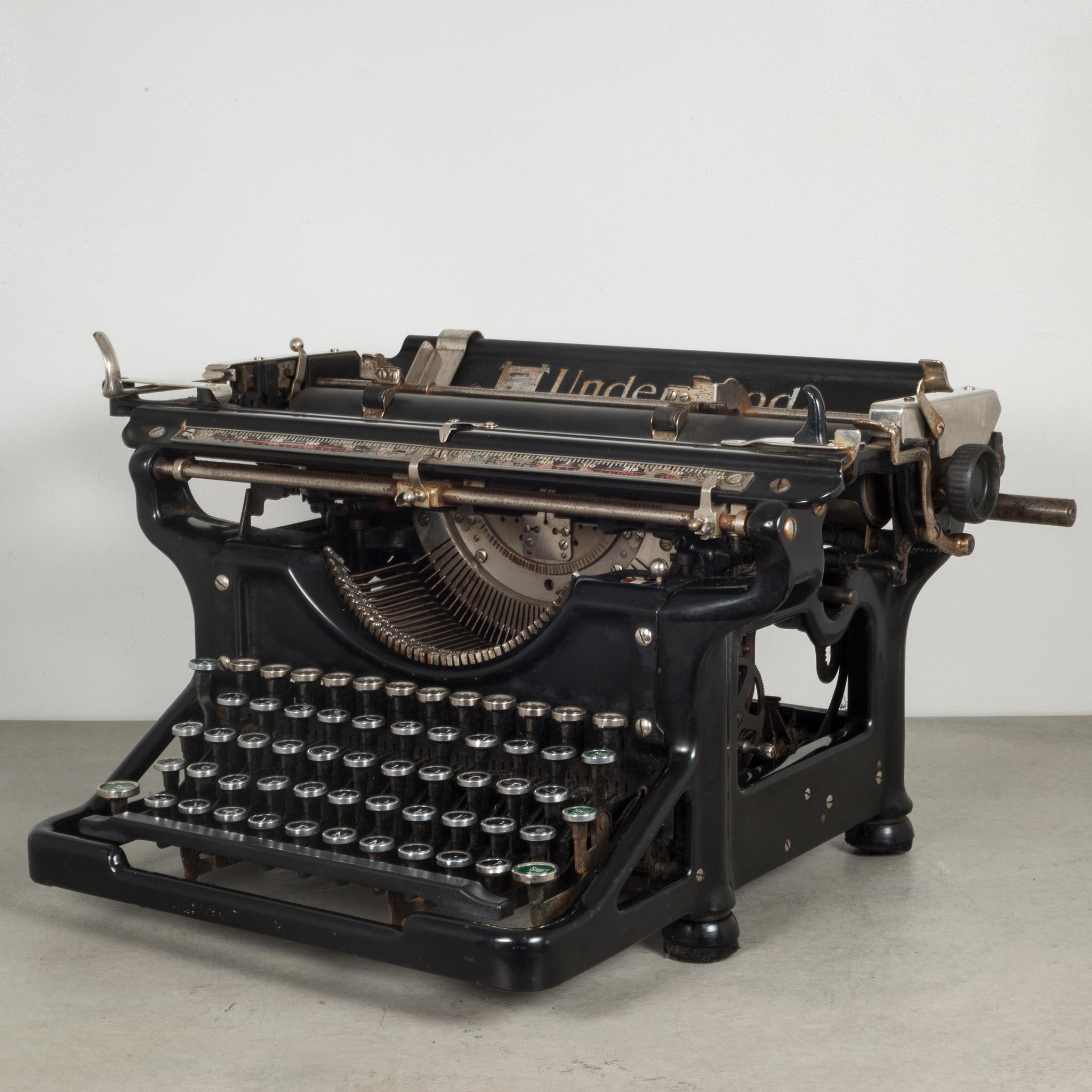 About

This is an original Underwood typewriter #6 12 with a 12 inch carriage and an open-frame design. The serial number is 4172824-12 stamped in the inside. The keys are nickel with black and white numbers and green and white on the sides. Five