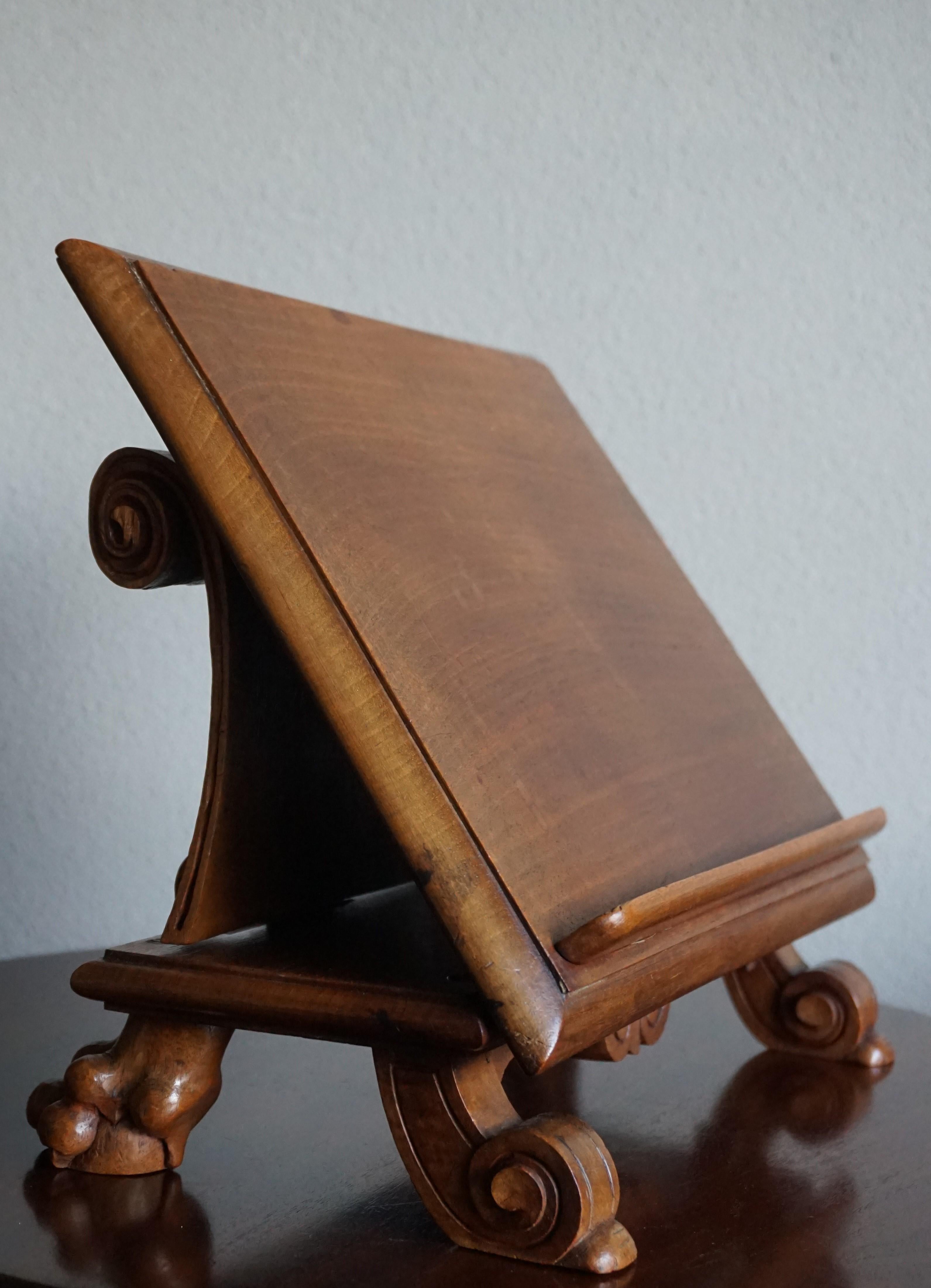 One of a kind antique book stand with scrolled leaf back.

If you are looking for the perfect way to display a book or photo or otherwise then this unique and decorative bookstand could be yours to own and enjoy soon. All handcrafted and hand carved
