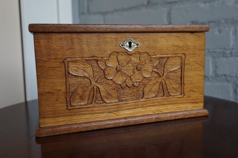 Great craftsmanship and pure elegance from the early 1900s. 

This wonderful and practical size, antique Arts & Crafts box is perfectly decorated on all sides with stylized flowers. This handcrafted work of beauty also is in superb condition, it has