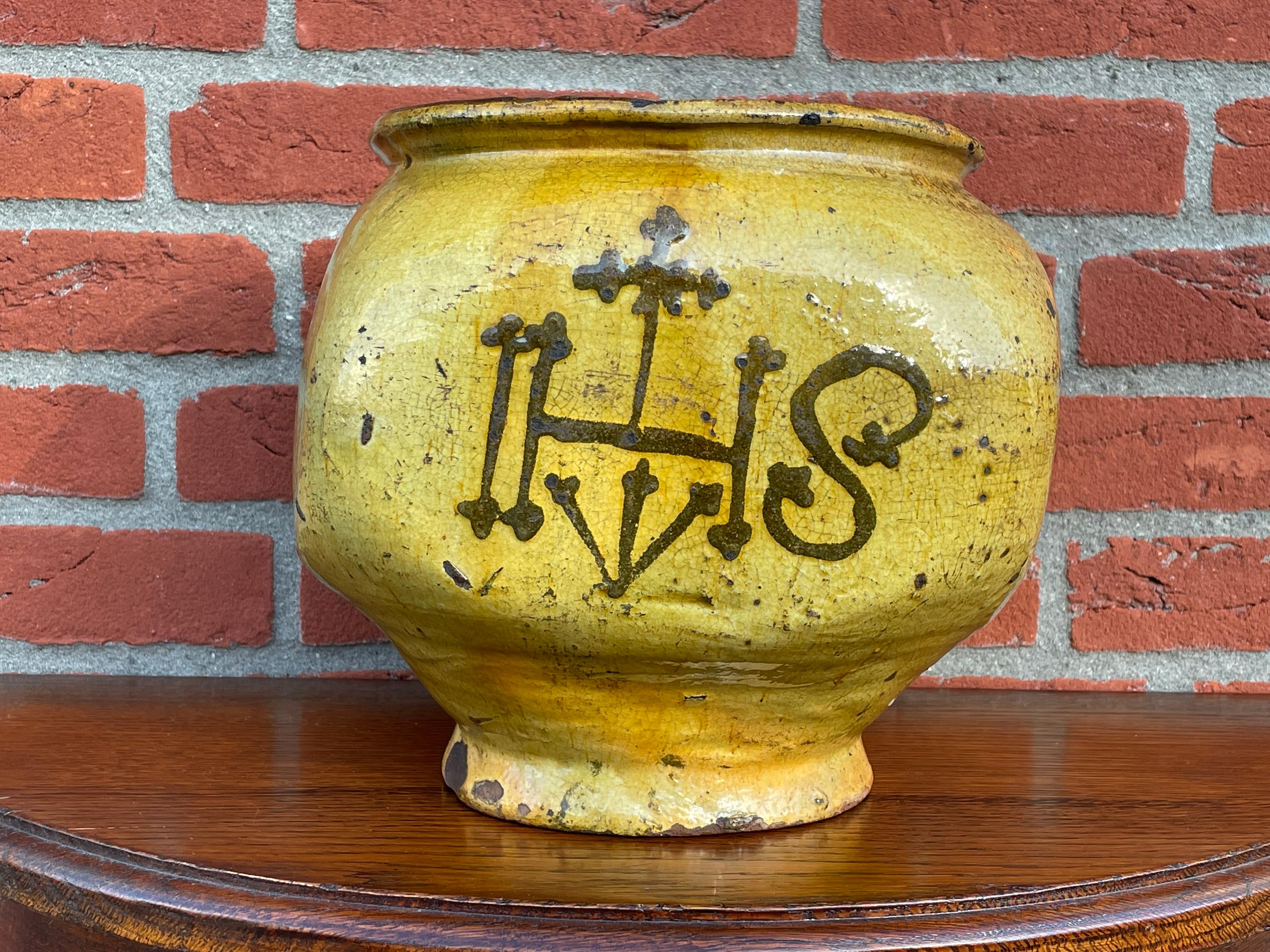 Unique glazed pot with a hand-painted and rare Gothic Christogram. Possibly medieval.

Over the past decades we have seen and sold many works of religious art, but we never before had the pleasure of offering such a unique and all handcrafted and