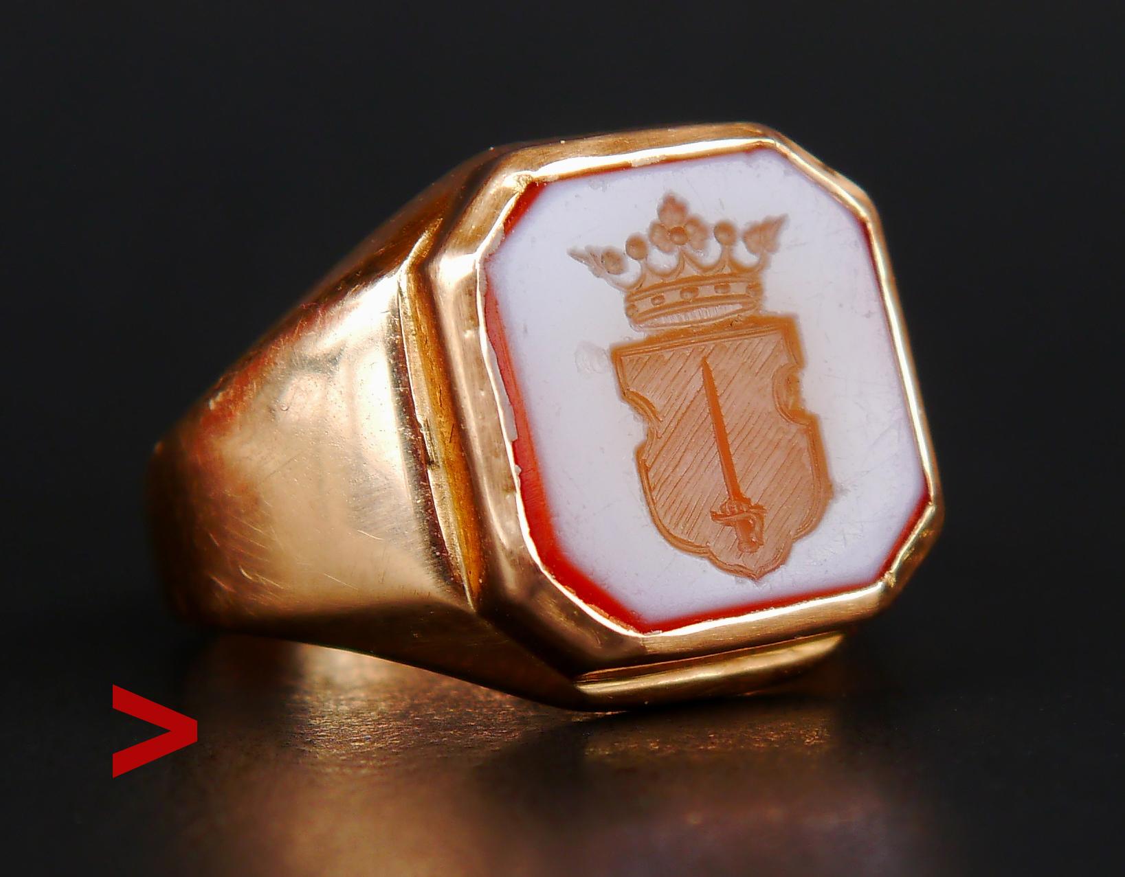 Signet intaglio Ring featuring banded / two layered Carnelian (type of Agate) stone with heraldic depiction of a Sword in the middle of the shield under the crown of Nobility. This is a Coat of Arms of Swedish noble family of Gyllensvärd ( Golden