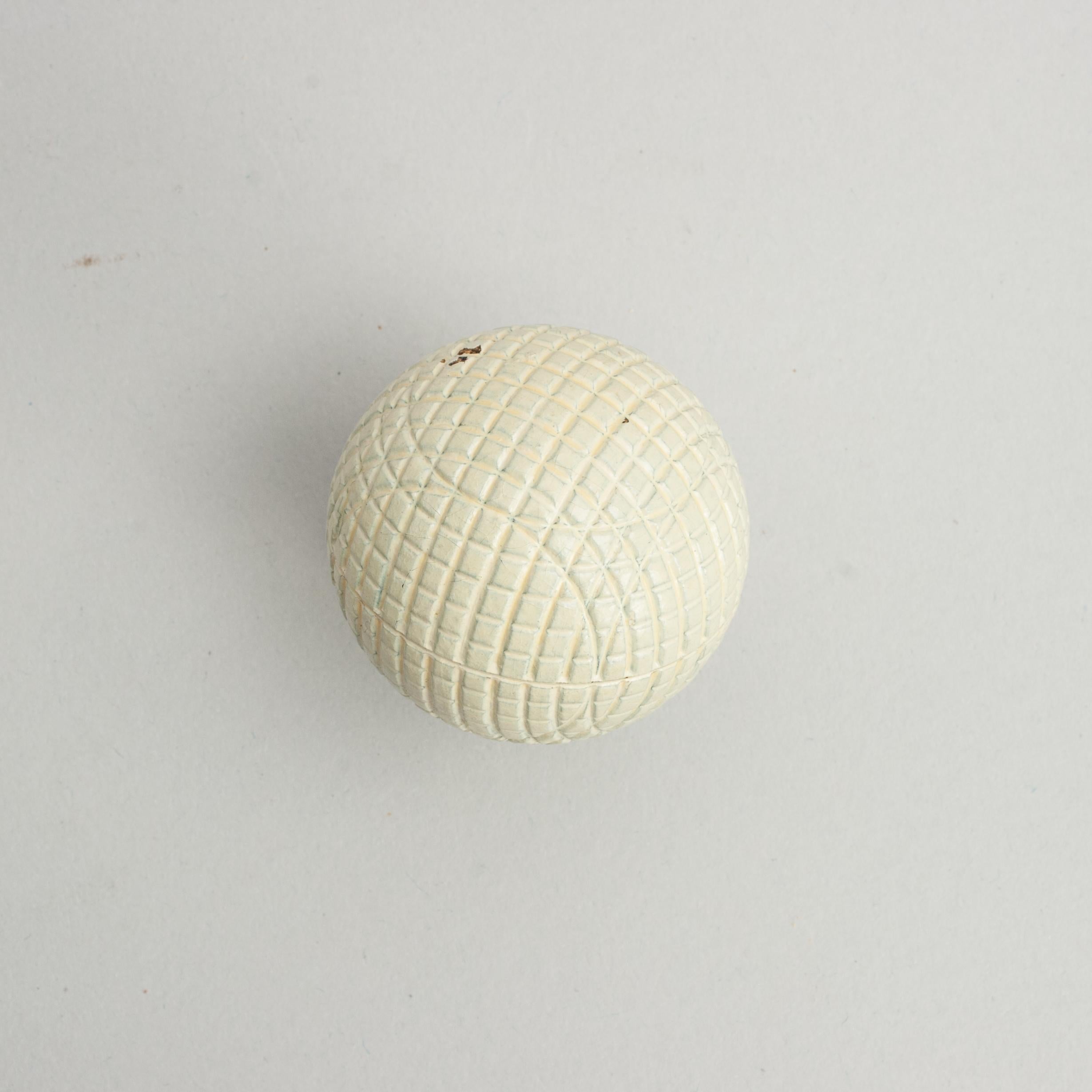 Unused Antique Gutty Golf Ball.
An exceptional example of a moulded mesh patterned Victorian gutta percha golf ball, manufacture unknown. The ball is in mint condition and is with the classic mesh pattern and original white paint.

The ball is