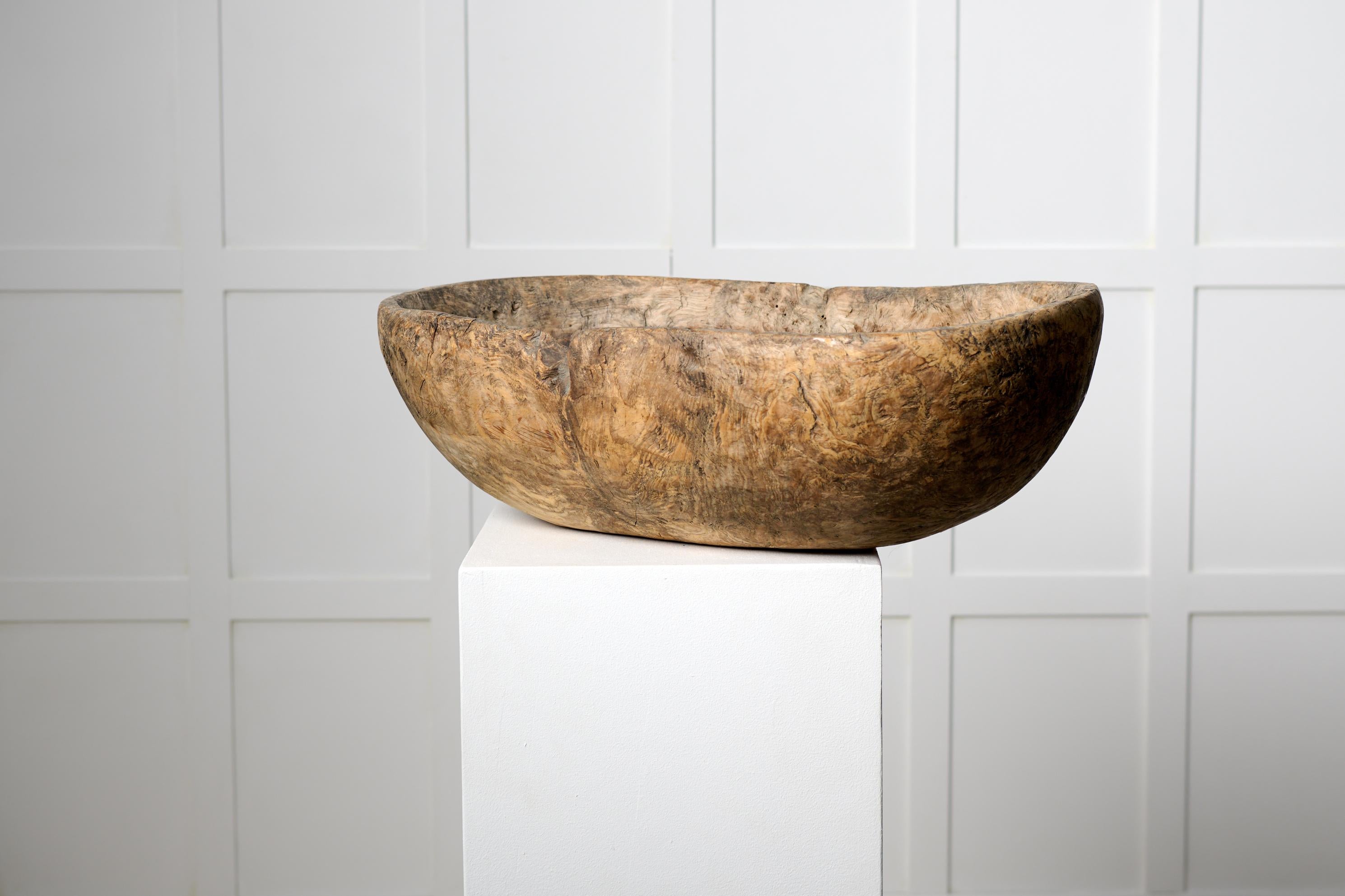Unusual Swedish antique bowl from the late 1700s. The bowl is a large and heavy root bowl in an organic shape made in solid birch root. Made by hand with a great patina after 200 years of use. It would have been used in the household during the 18th
