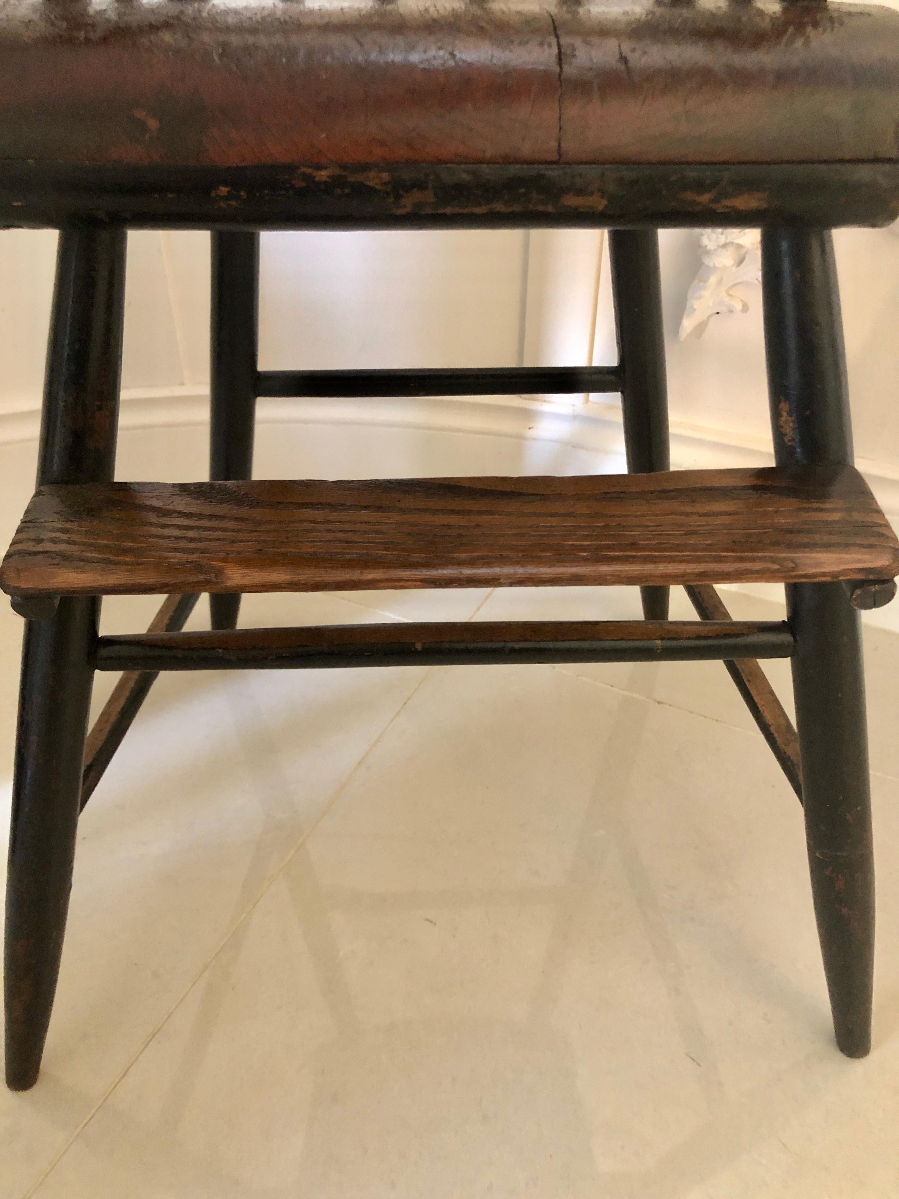 Unusual antique Victorian baby’s high chair having a shaped top rail supported by six turned columns. It boasts a lovely shaped seat which is supported by four turned legs and united by shaped columns with an unusual foot rest. 

In lovely