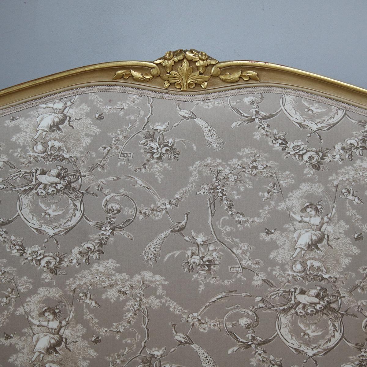 A Louis XV style bedstead with painted and gilded framework and upholstered panels. The bed comes with its original runners within the side runners. The base and mattress will need to be shaped due to the bow foot.

The bed accepts either a double