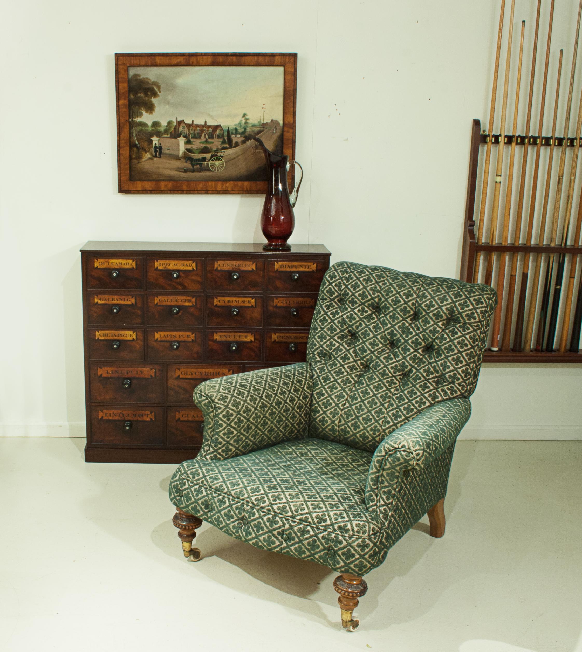 Howard style button back armchair.
A 19th century Howard style button back upholstered armchair with walnut turned front legs and square sweeping back rear legs. The front legs raised on cup castors with white ceramic wheels.

The name of Howard