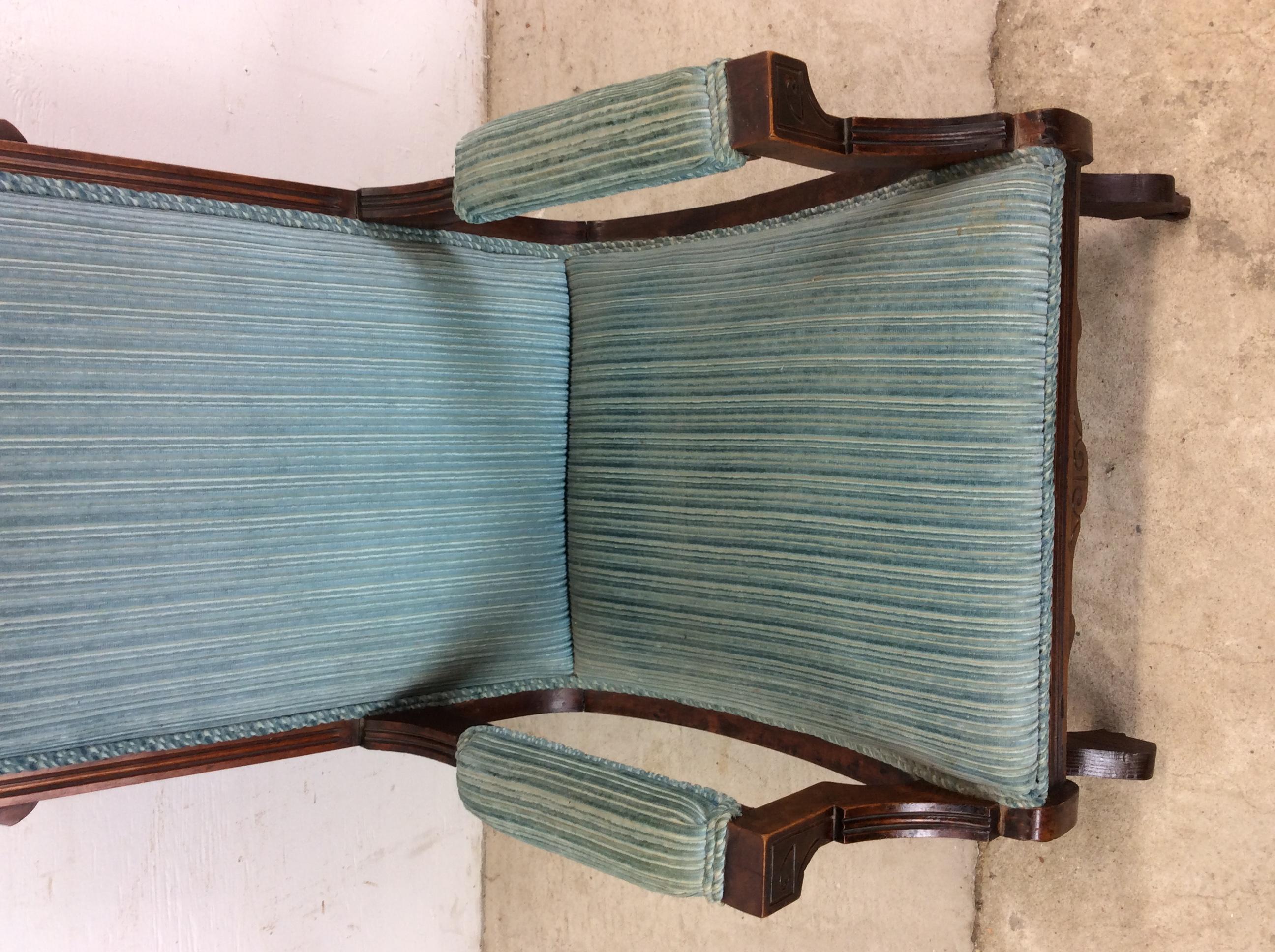 Antique Upholstered Rocking Chair with Carved Wood Detailing Victoriano en venta