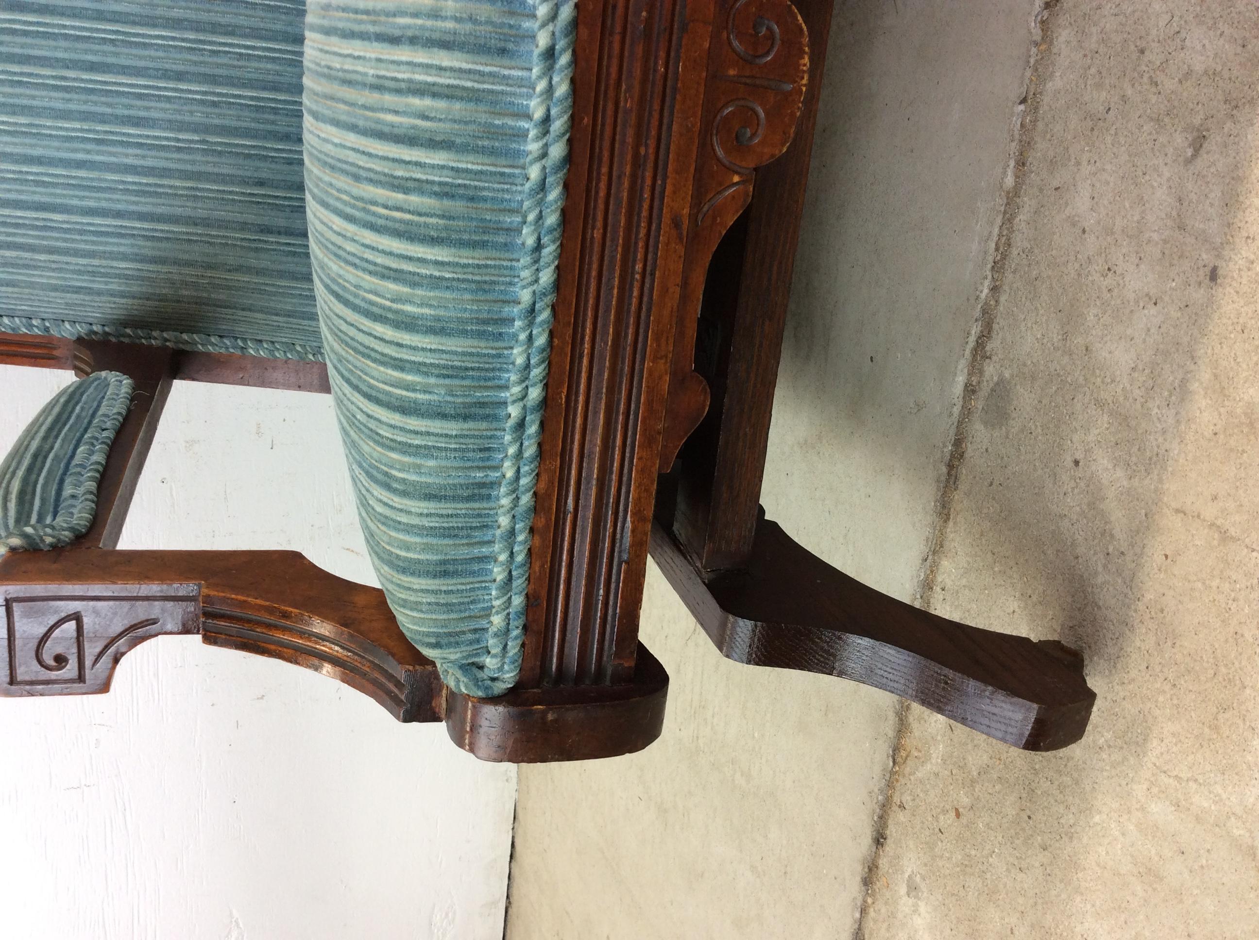 Antique Upholstered Rocking Chair with Carved Wood Detailing Madera en venta