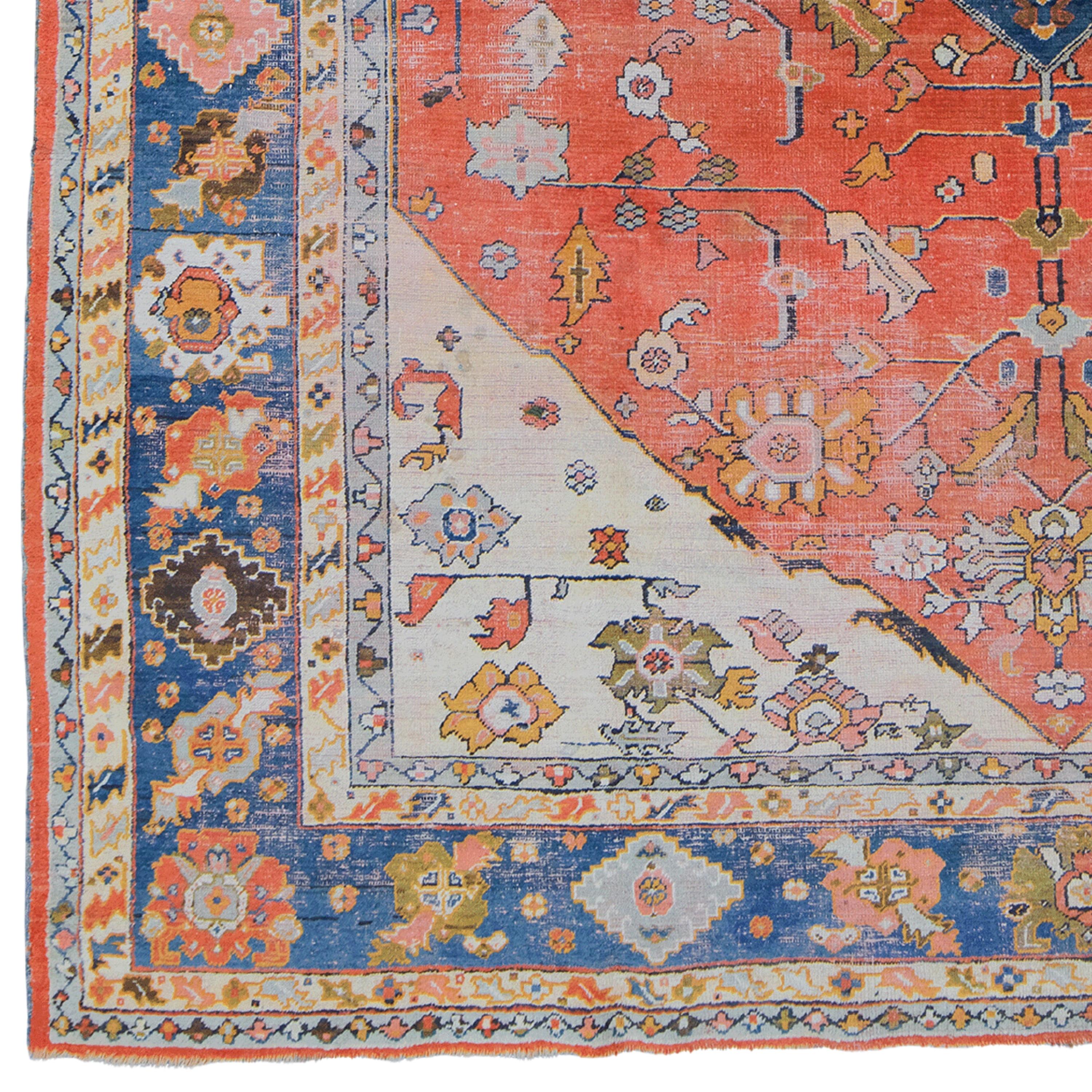 This elegant antique Turkish Uşak carpet dates from the late 19th century and displays the finest craftsmanship of its period. With its rich color palette and detailed patterns, this rug can turn any space into a sophisticated art gallery. Thanks to