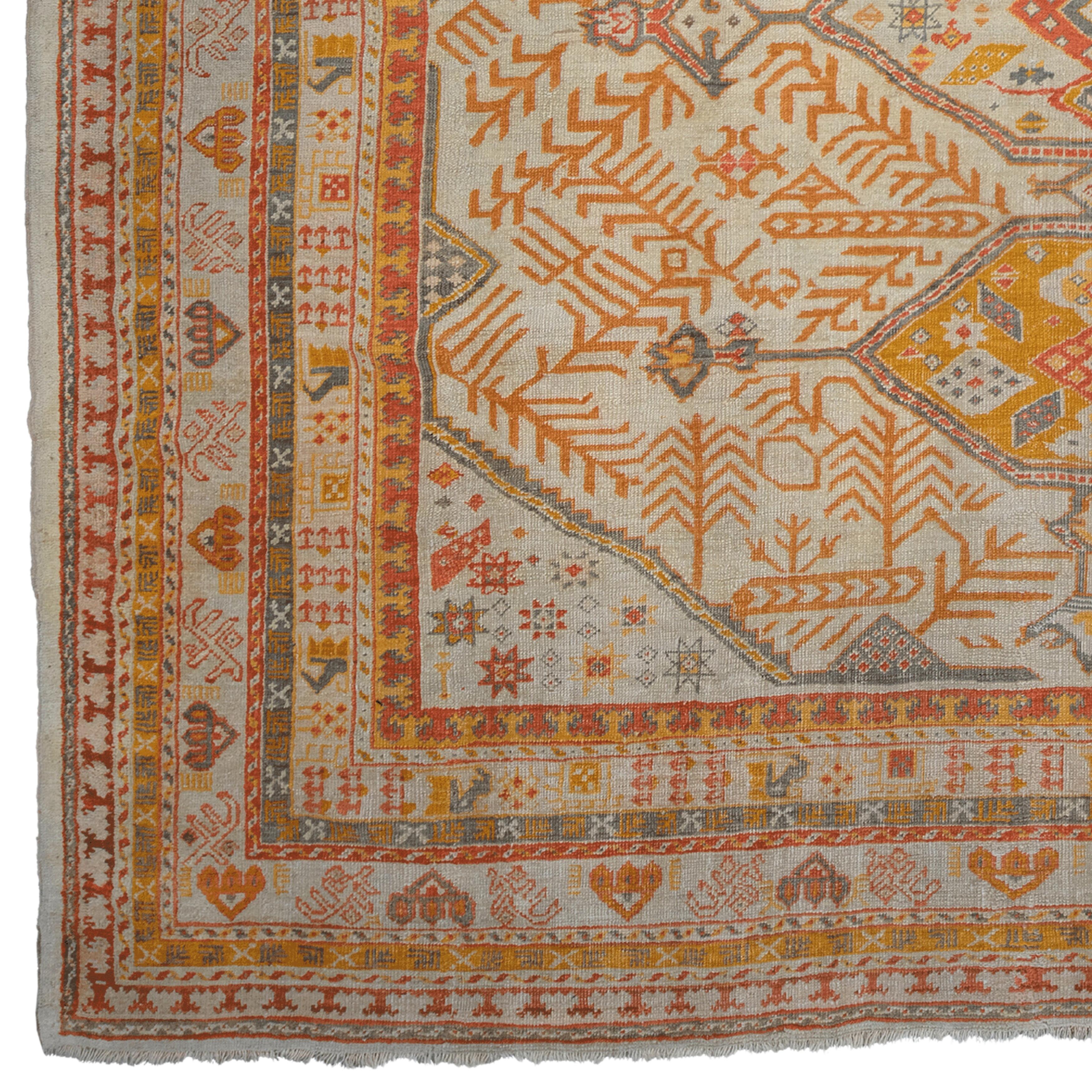 Antique Ushak Rug - 19th Century Antique Turkish Rug
Size: 305x360 cm

This elegant 19th century Ushak carpet brings the elegance and sophisticated design of the Ottoman period into your home. With its rich color palette and detailed workmanship,