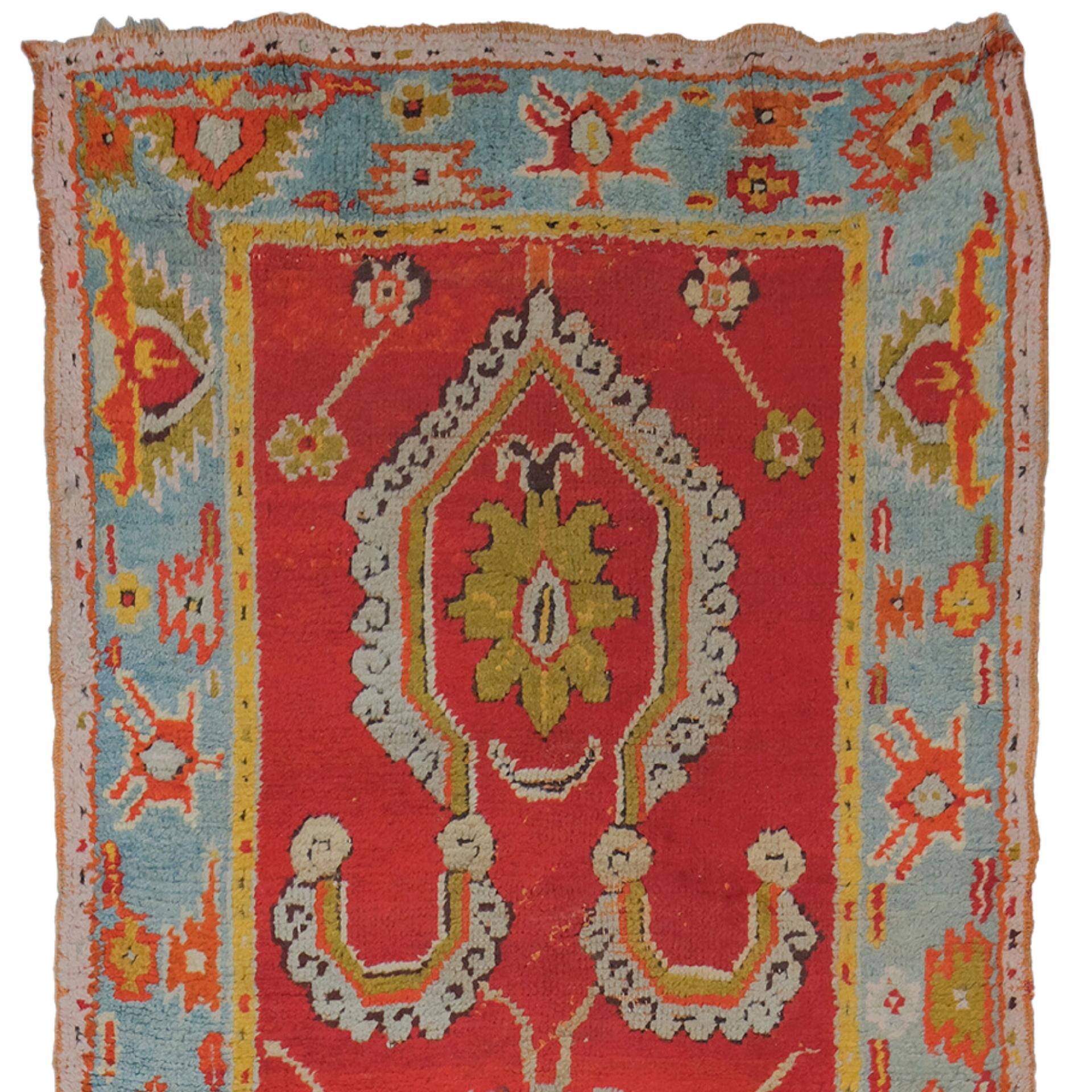 Antique Ushak Rug - 19th Century Ushak Runner

This antique Ushak carpet brings the elegance and sophisticated design of the Ottoman period to your home. This hand-woven rug in rich red and blue tones is eye-catching with its carefully crafted