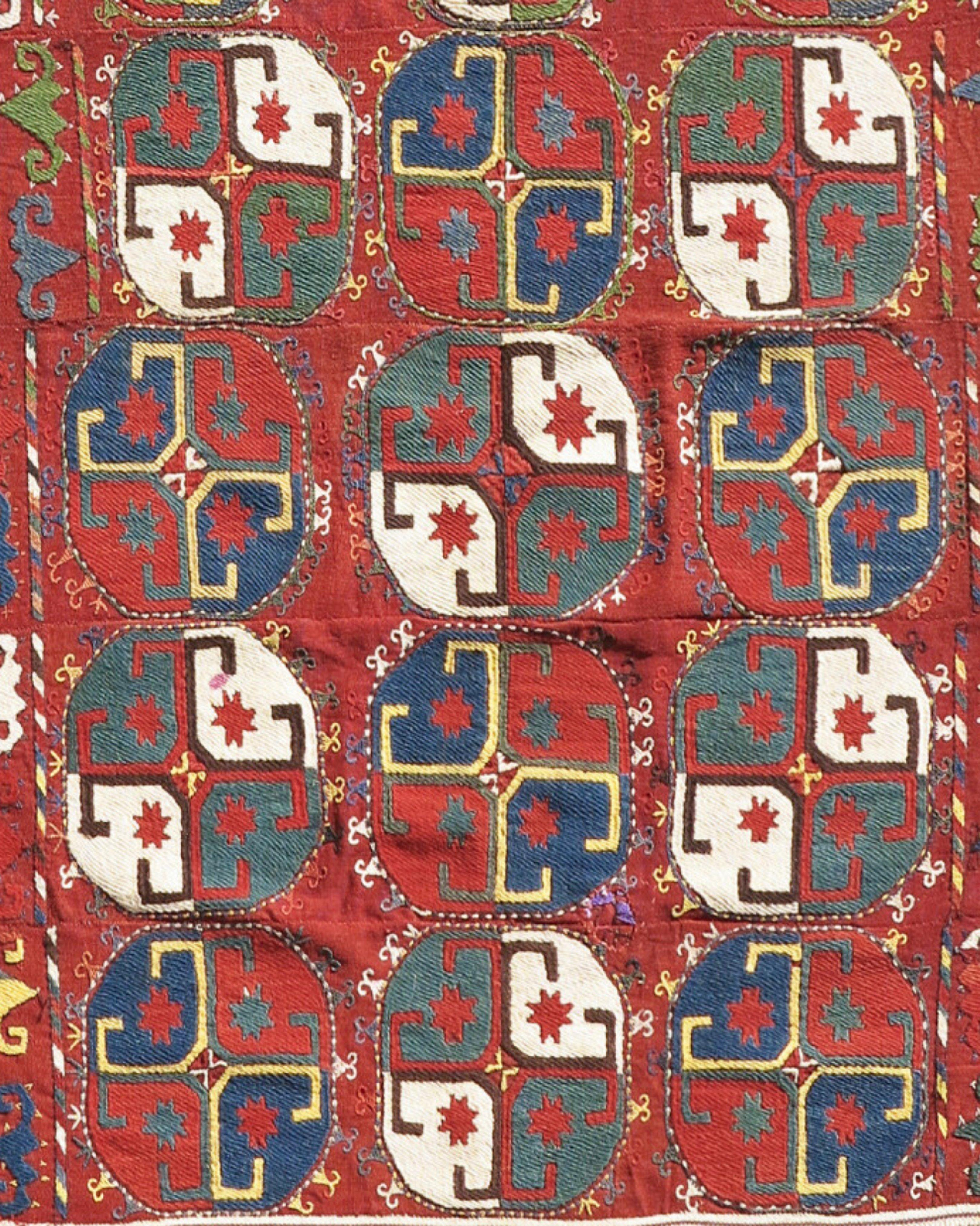 Antique Uzbek Mixed Technique Flatwoven Rug, Early 20th Century

The colorful quartered medallions, or ‘guls,’ with cruciform centers embroidered on this Central Asian flat weave are thought by most authorities to be the work of Lakai Uzbek weavers.